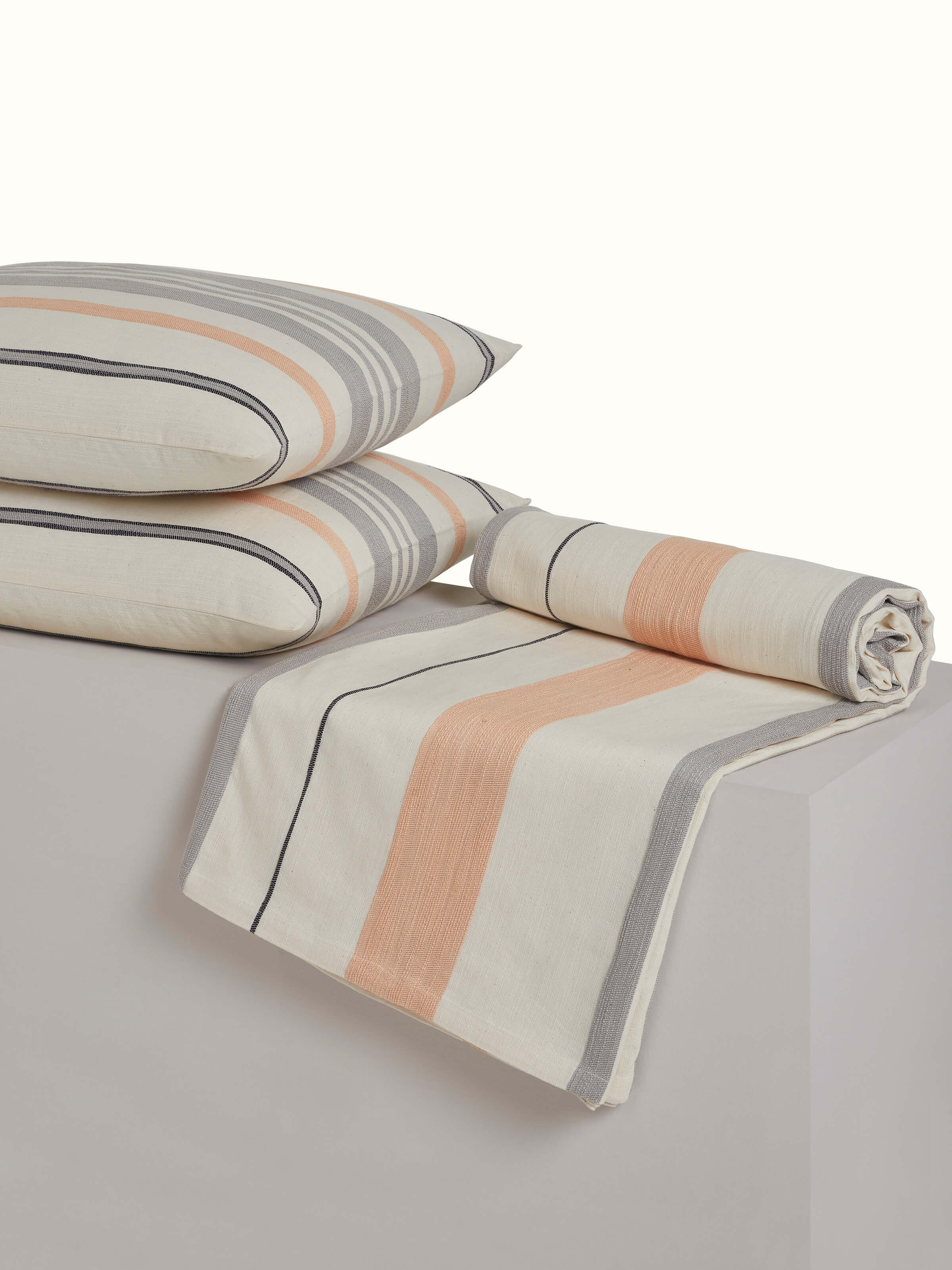 Angled view capturing the full bedspread set layout and stripe alignment of Neerja grey handloom set