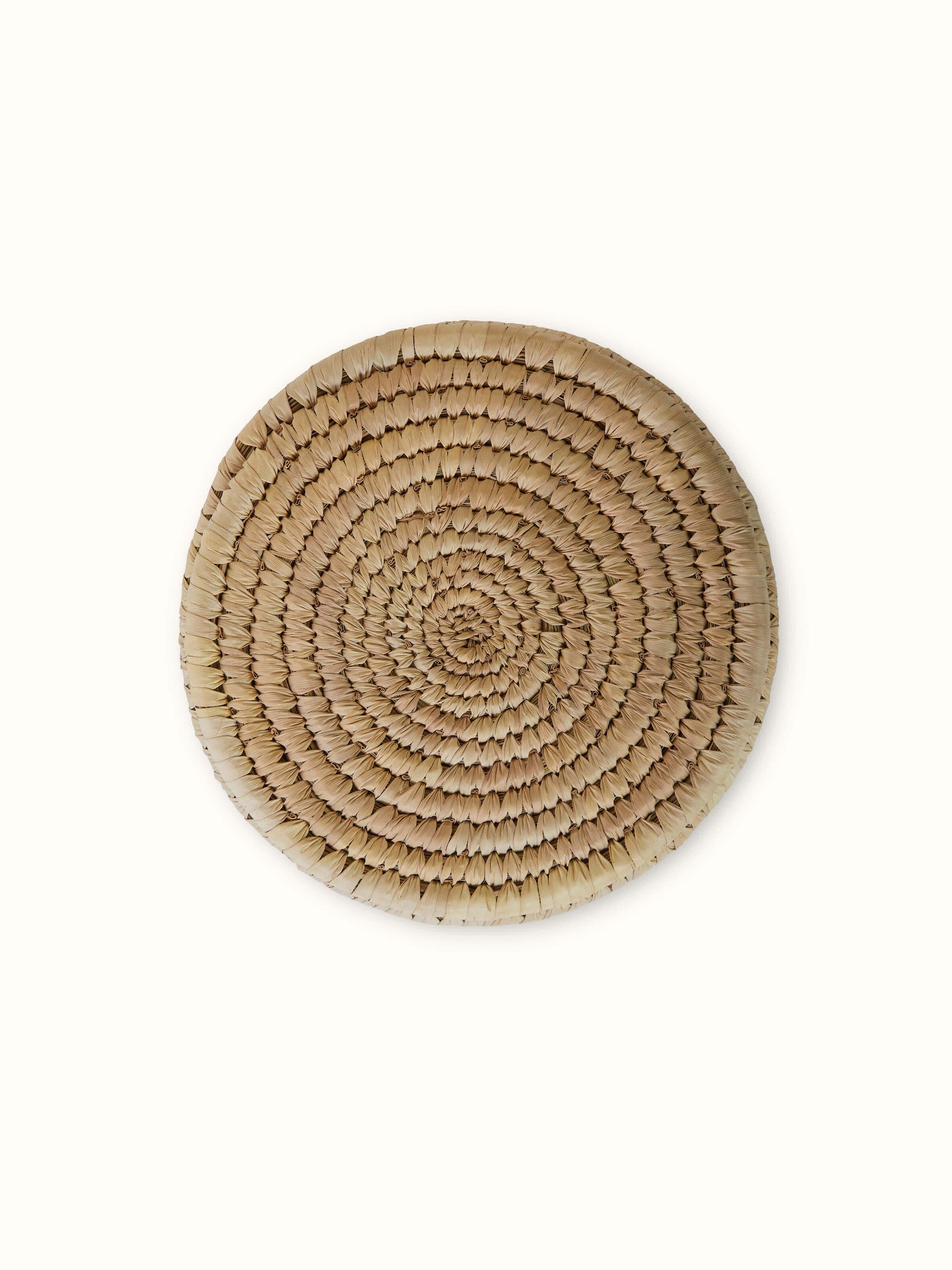 Angled view of Natural kanshi fibre storage basket highlighting its natural look