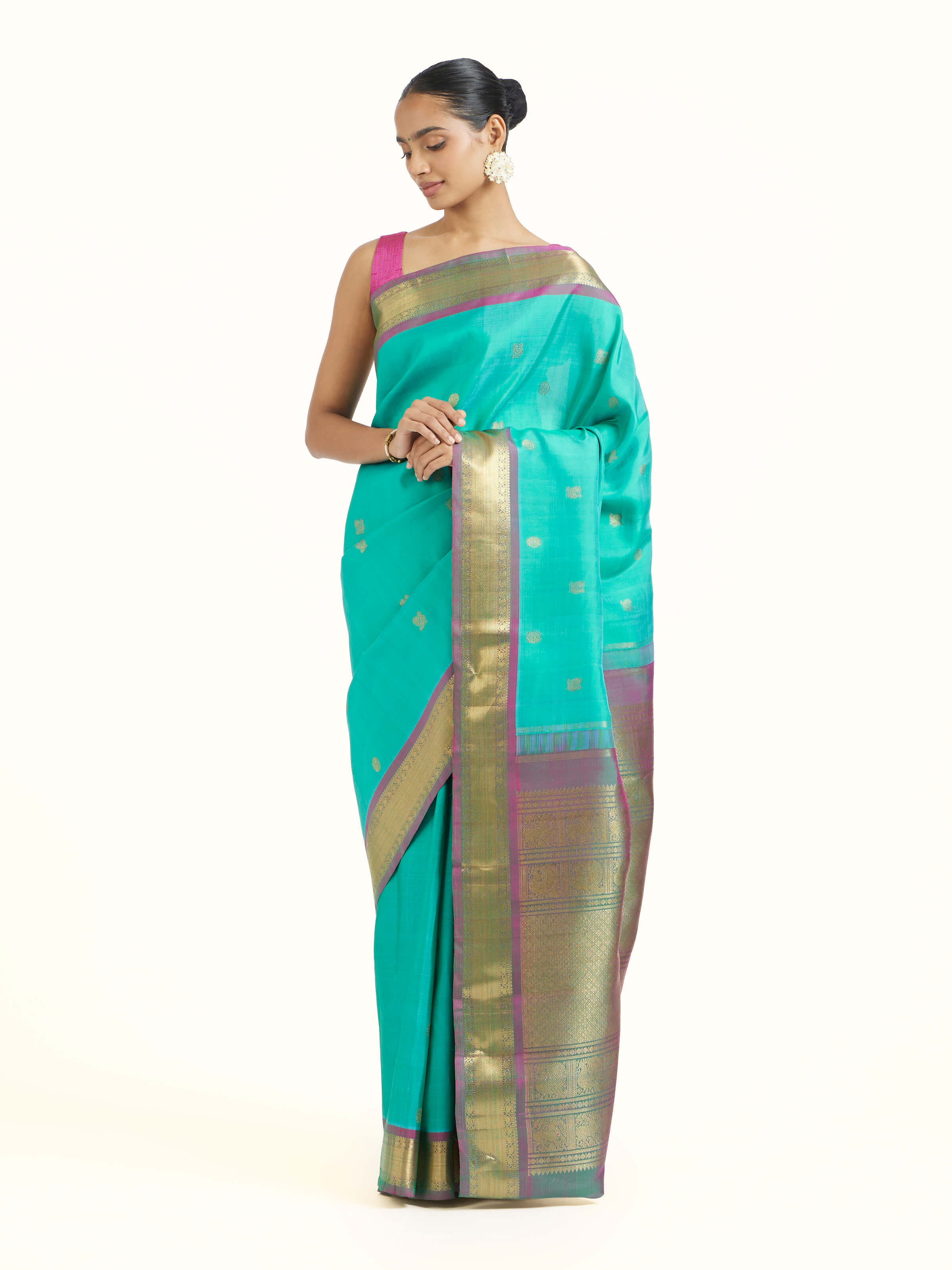 Side view of blue silk Kancheepuram saree showcasing flowing drape