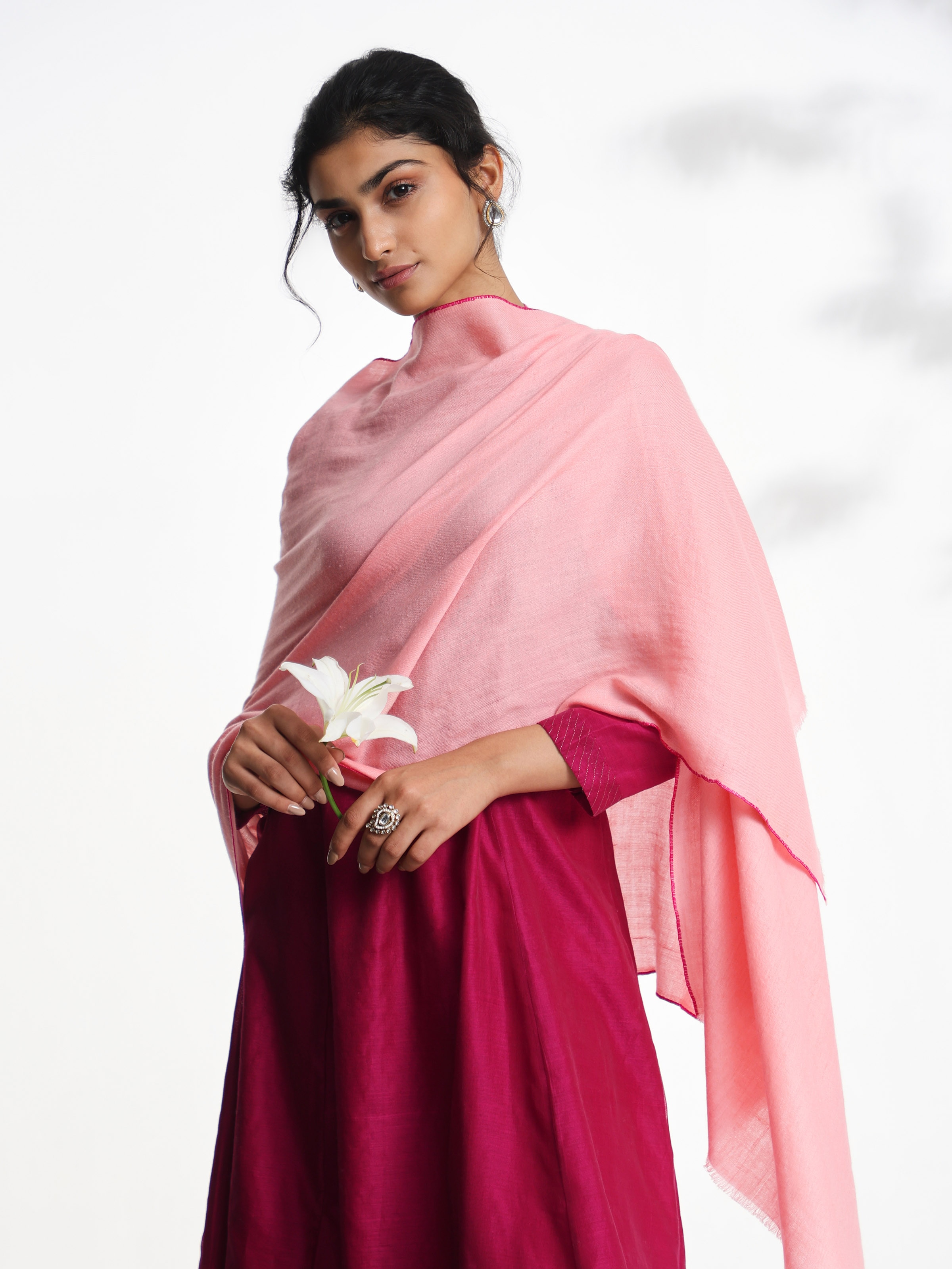 Angled view of pink cashmere kaaj embroidered handwoven stole emphasizing kaaj detailing