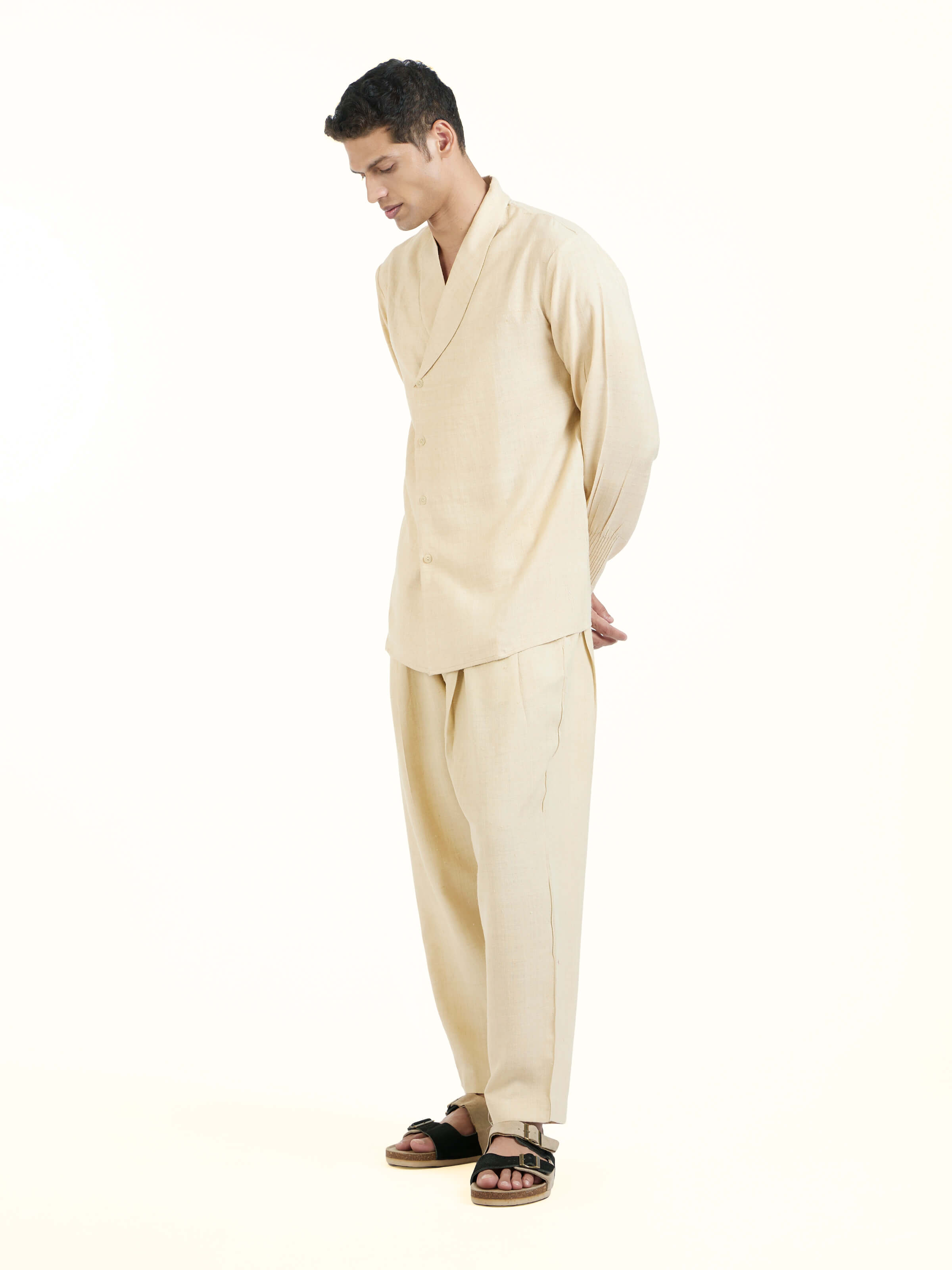 Side view of beige silk handloom jacket highlighting tailored fit