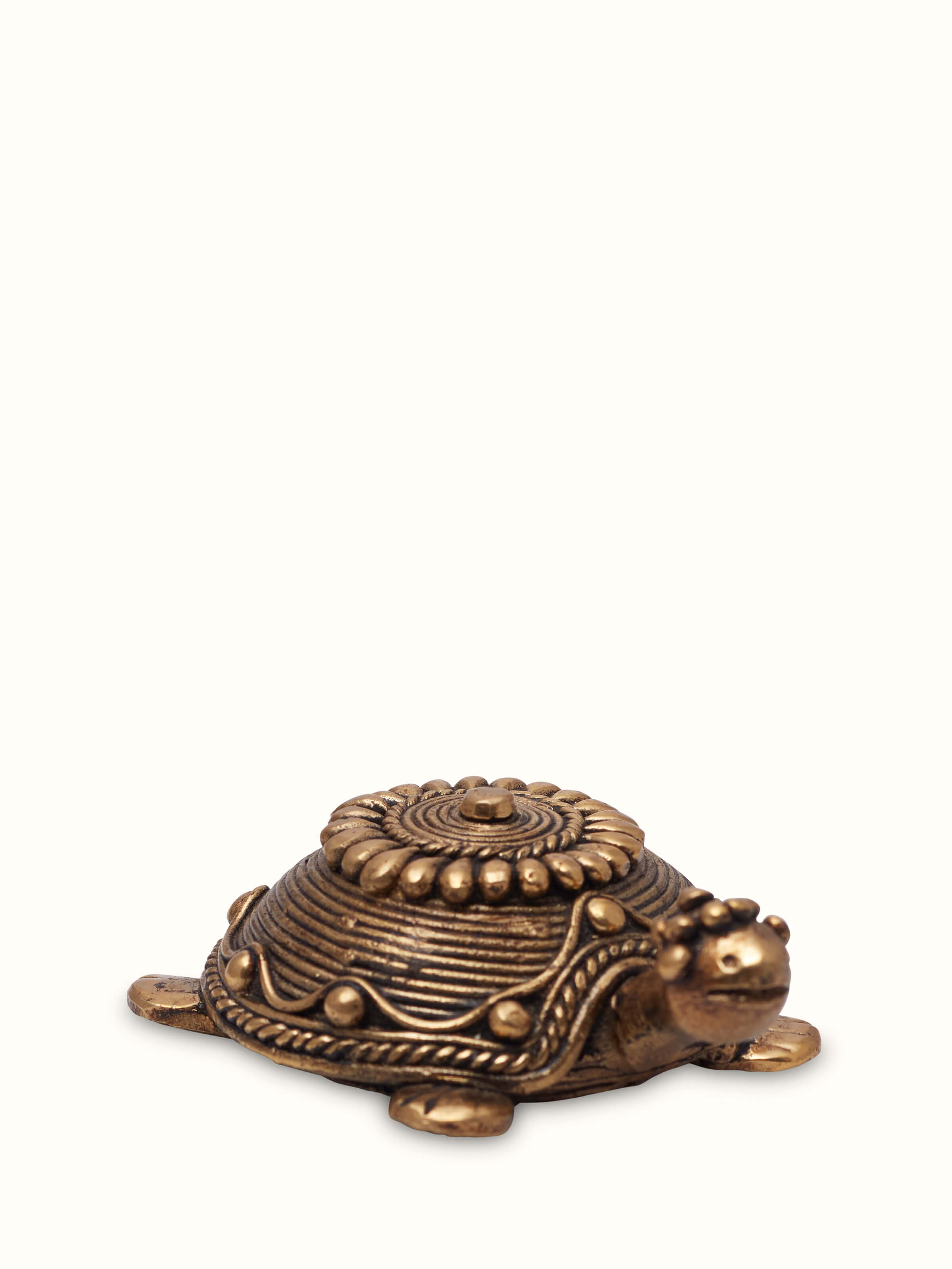 Angled view of dhokra tortoise brass figurine handcrafted tribal art decor