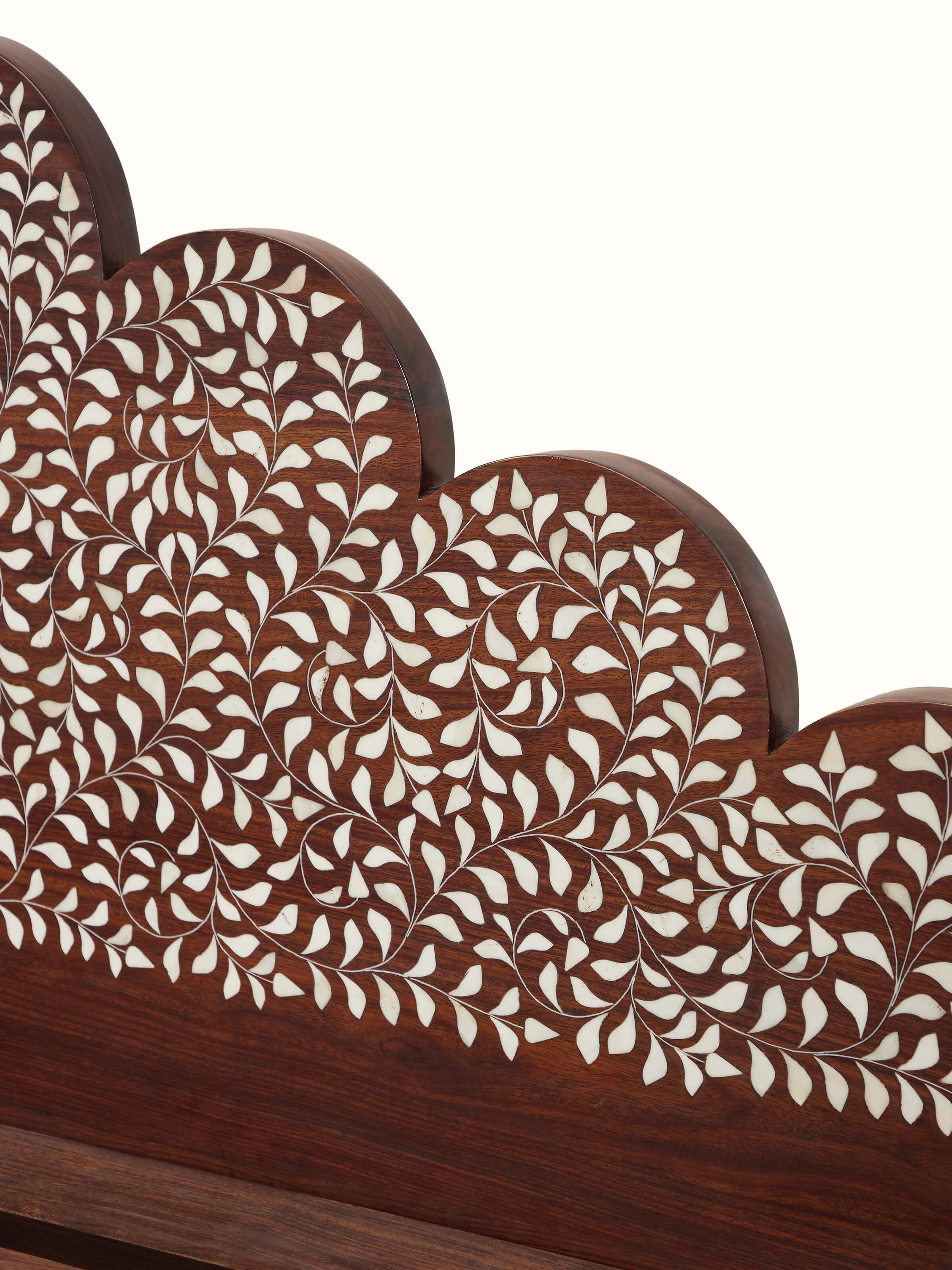 Side view of Sheesham wood king size bed with bone inlay, showing the blend of traditional craftsmanship and modern luxury.