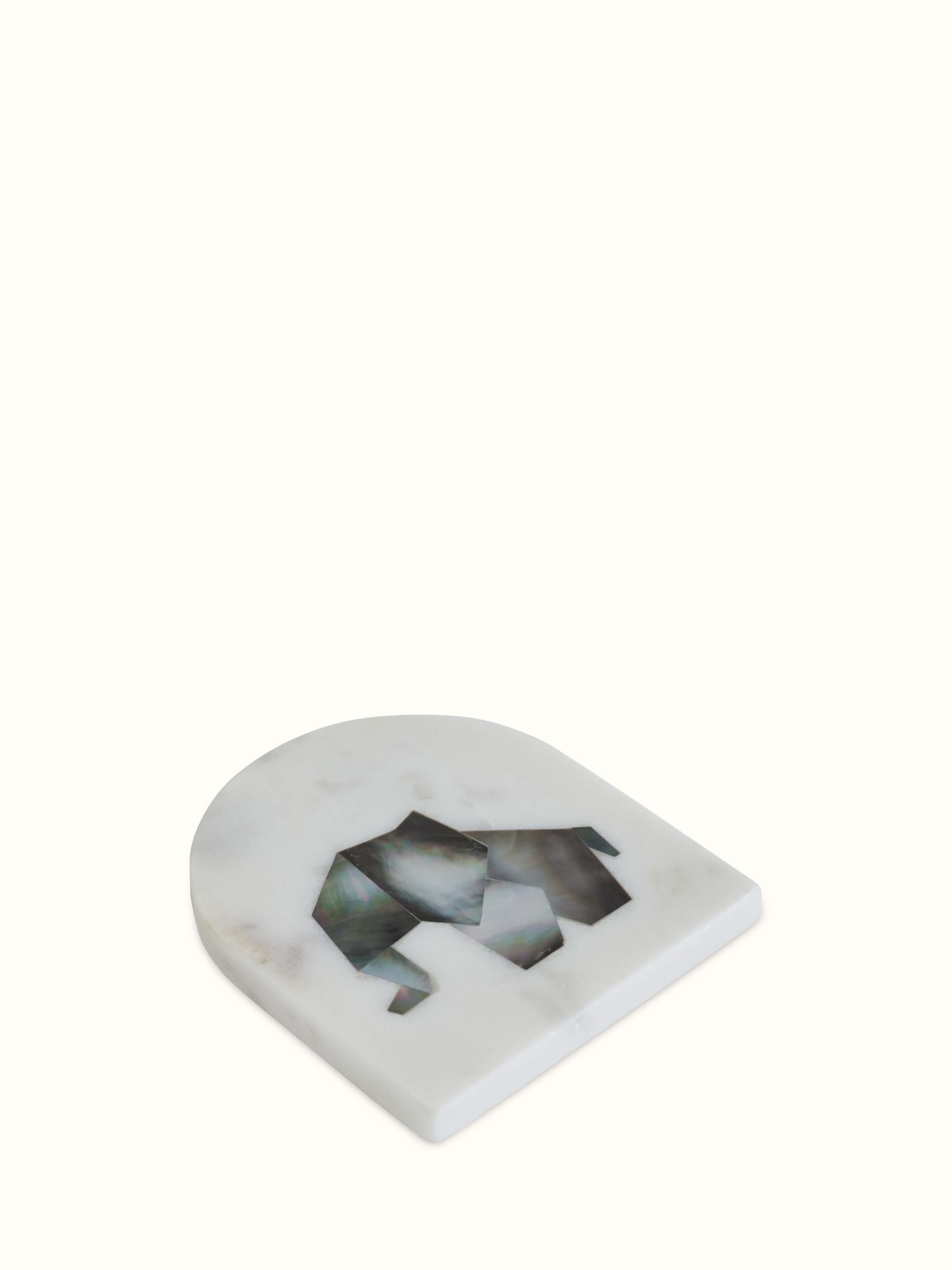 Detail close-up of marble animal carving coaster showing carved motif