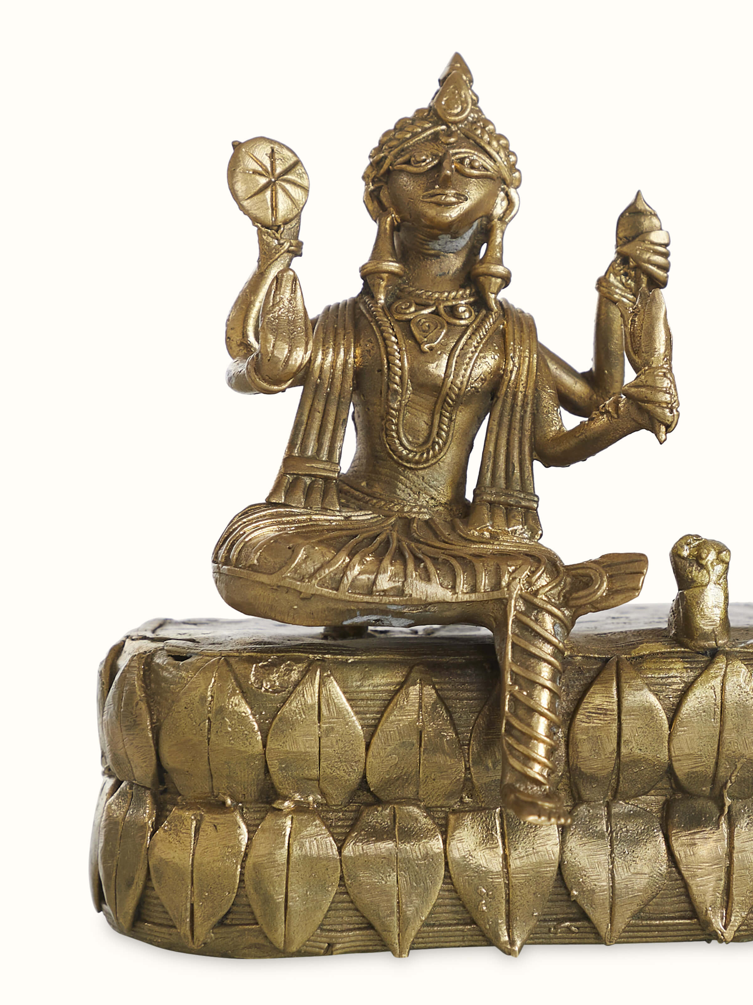 Detail close-up of Dhokra brass Shiva Parvati idol showing metalwork