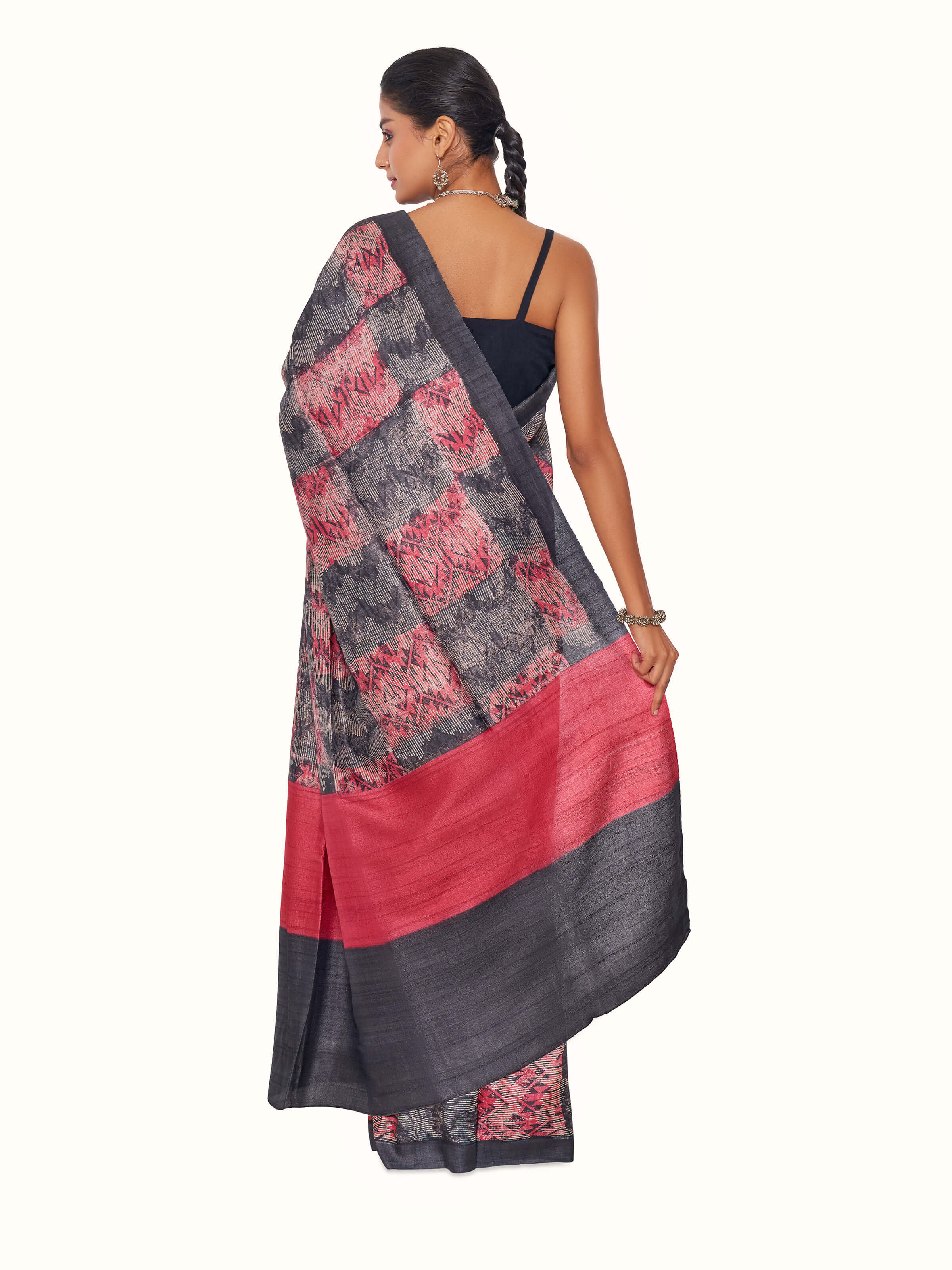 Back view of black tussar silk discharge block printed saree displaying overall design