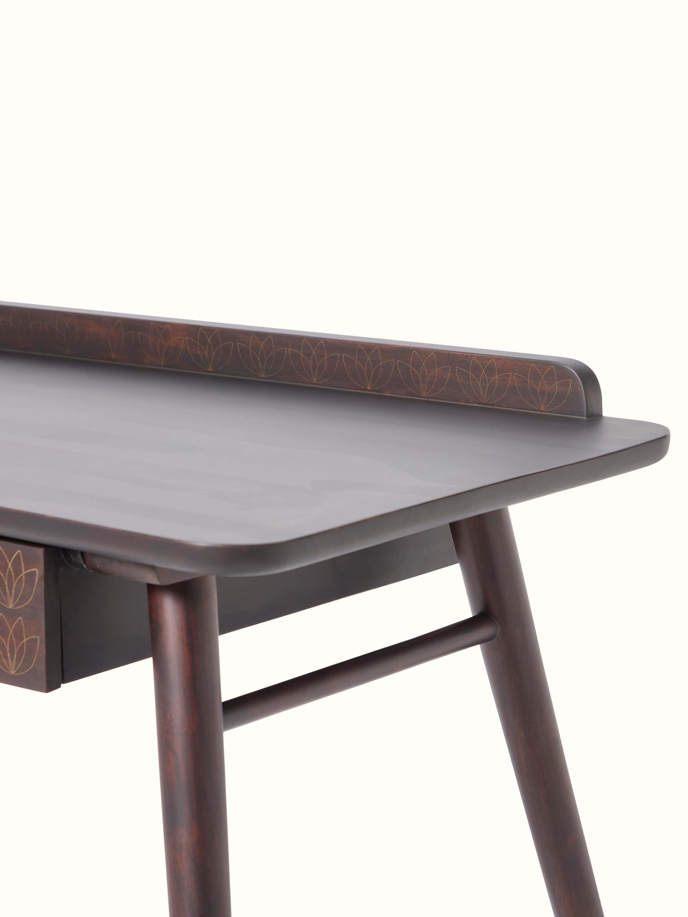 Side view of Sheesham wood study table with brass tarkashi inlay, showcasing the quality of the wood and the ornate inlay work