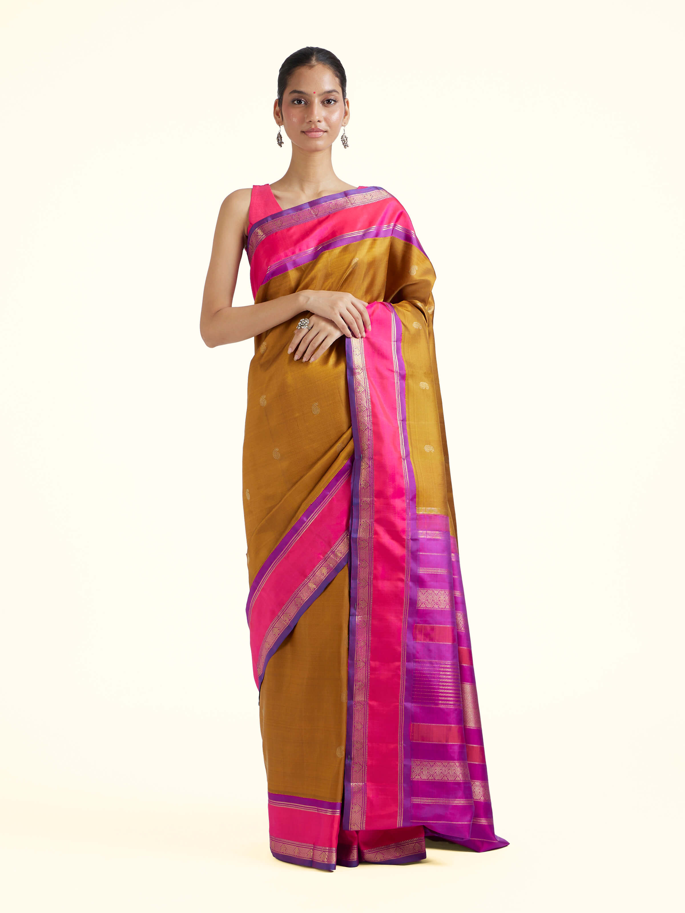 Front view of olive silk Kancheepuram saree with rich zari woven motifs