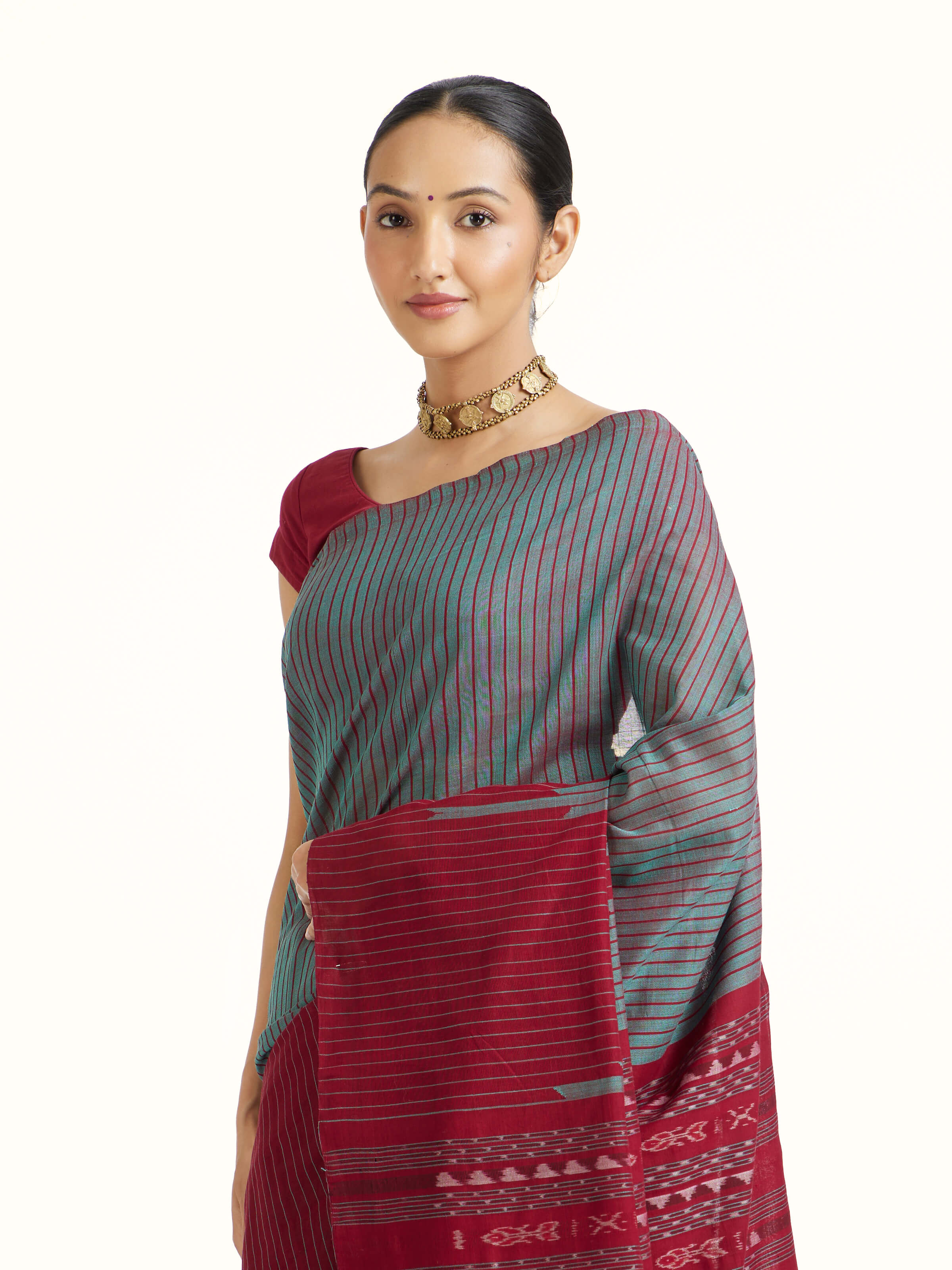 Angled view of Green Cotton Bandha Odisha Ikat Saree revealing the depth of its color and intricate pattern