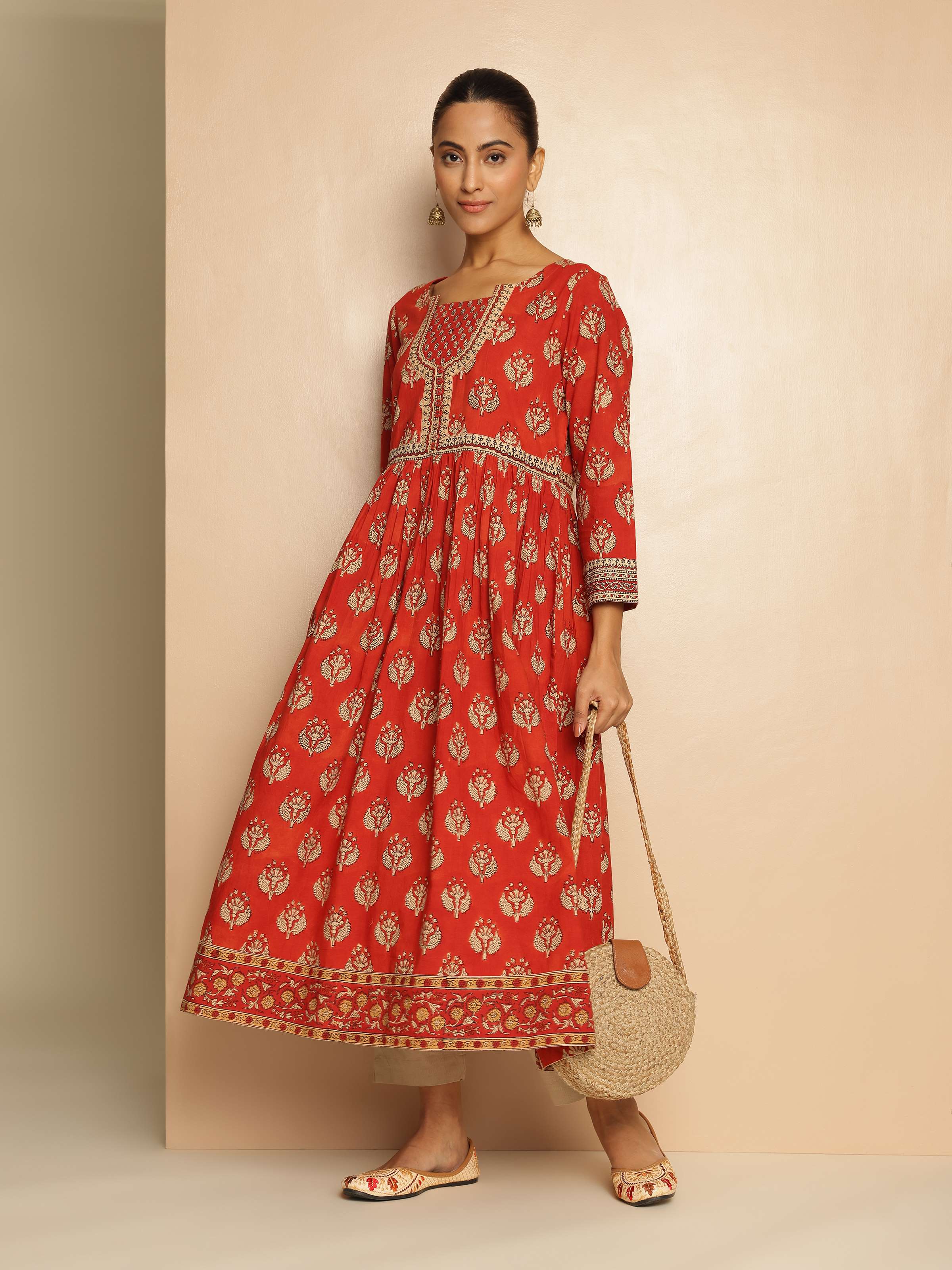 Lifestyle view of red Bagru block printed kurta styled with matching accessories