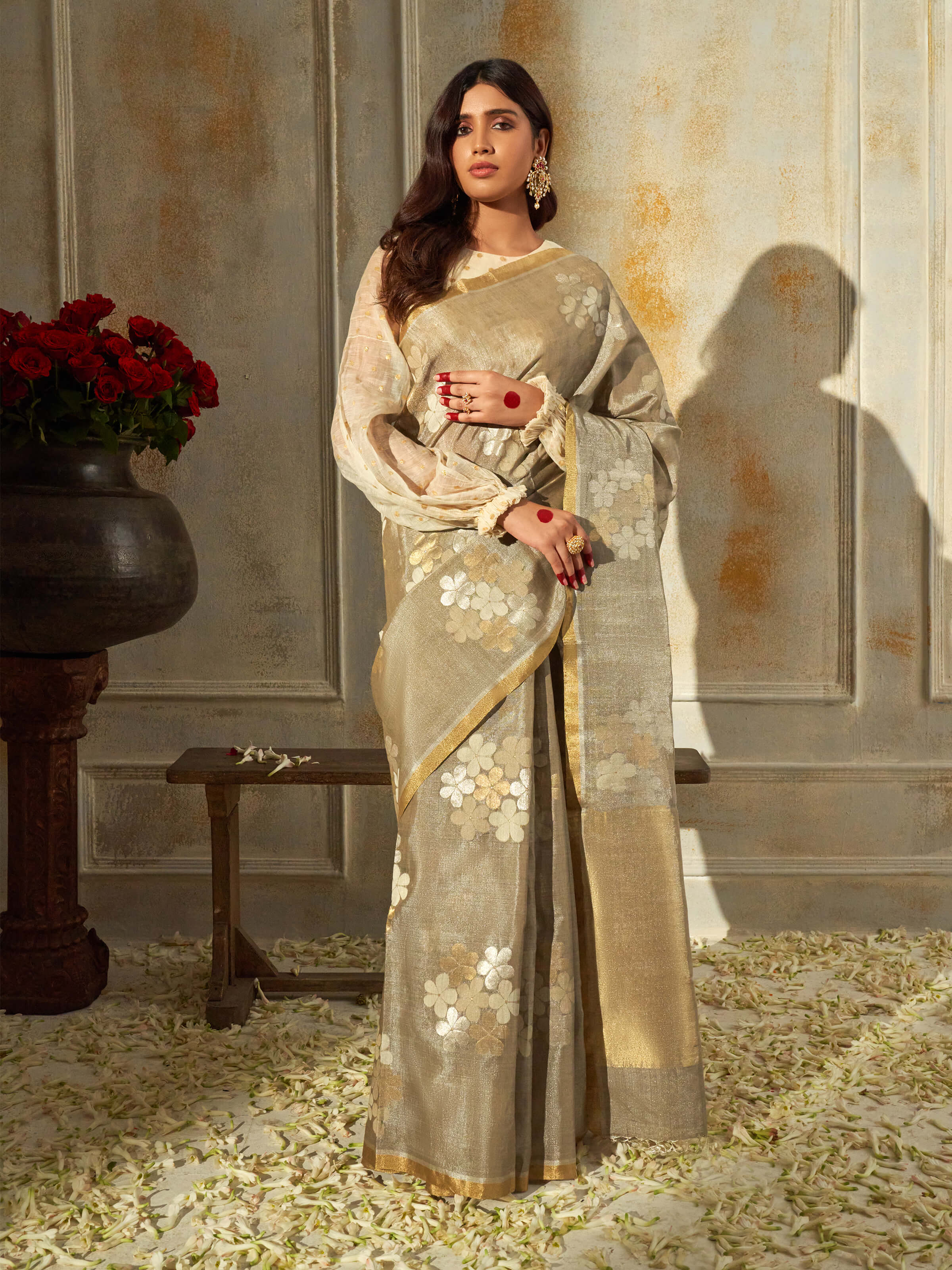 Side view of grey tussar silk saree with elegant drape and fall