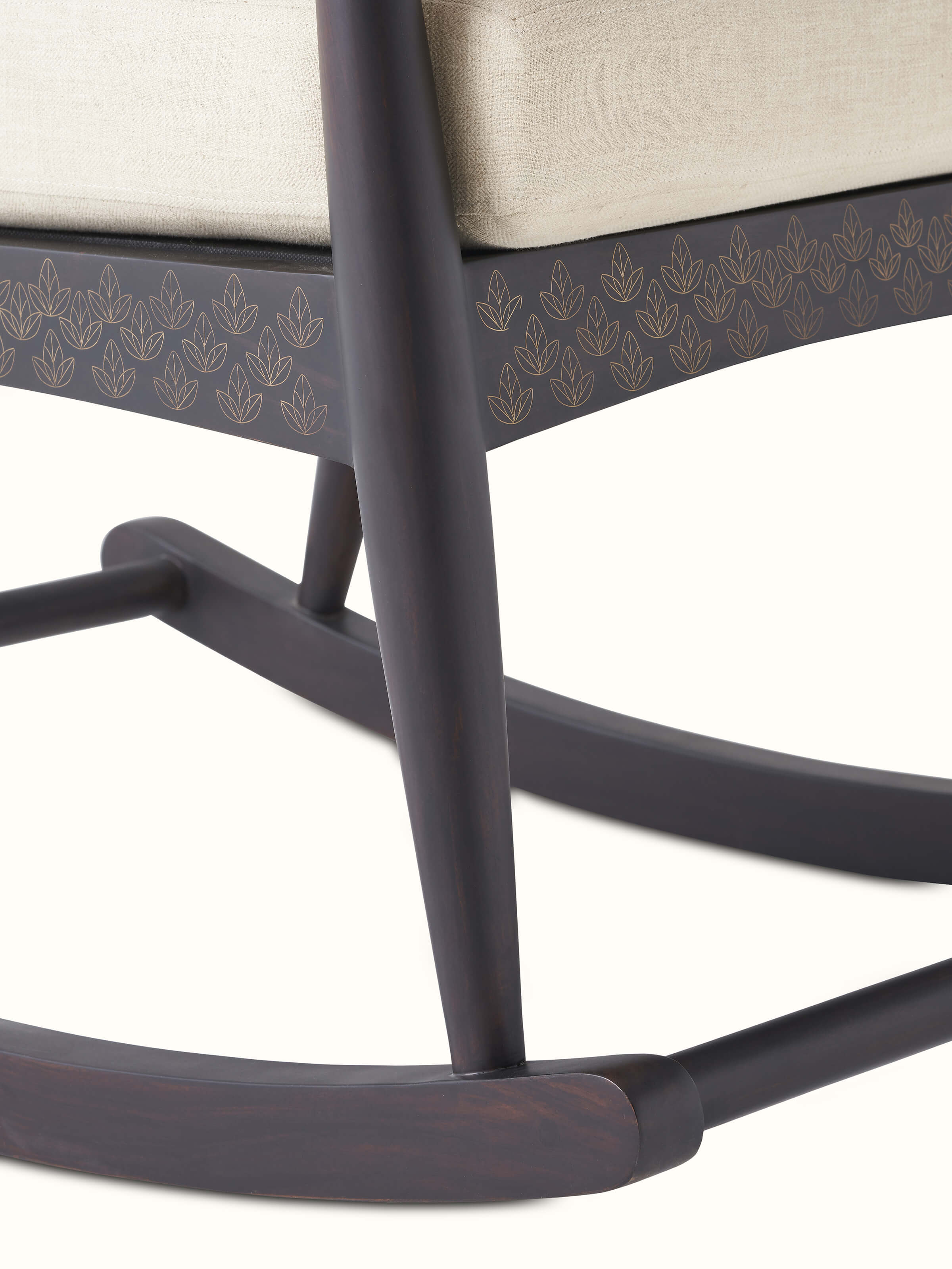 Sheesham wood and brass tarkashi rocking chair with visible craftsmanship, highlighting the elegant and traditional design elements.