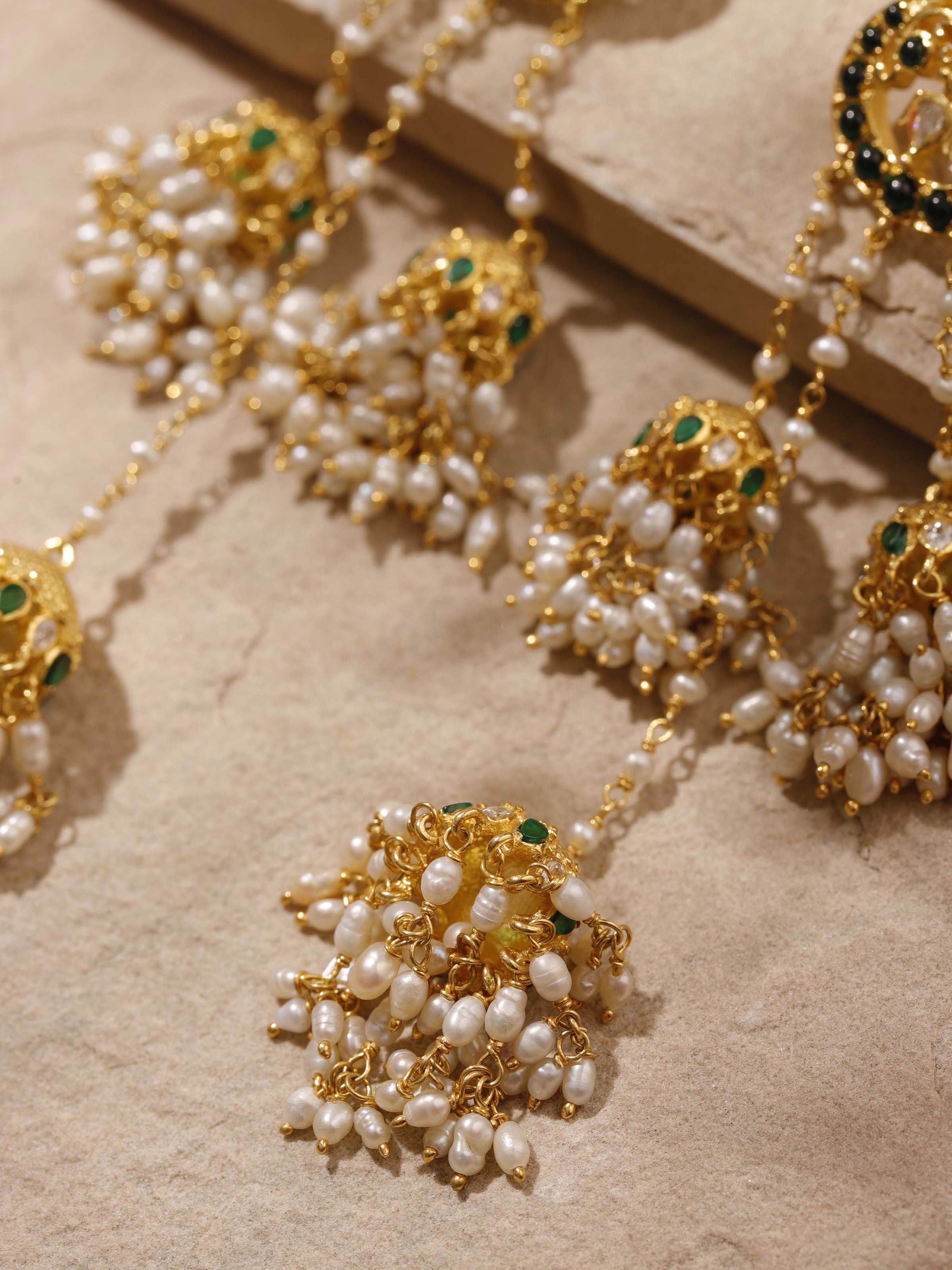 Close-up image showing texture and artisan silver smithing of Guttapusalu earrings