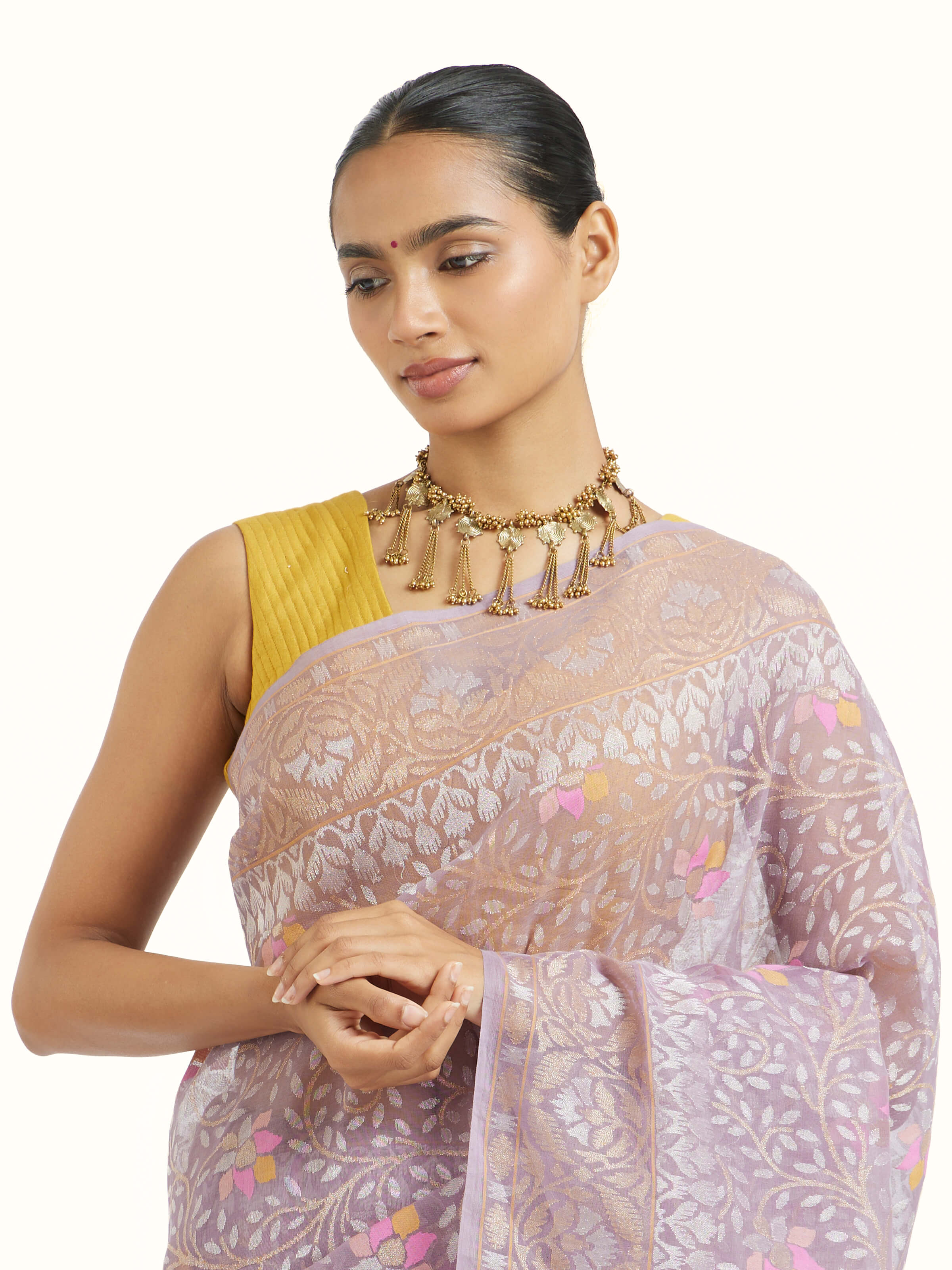 Angled view of purple cotton Awadh Jamdani Banarasi saree highlighting jamdani patterns