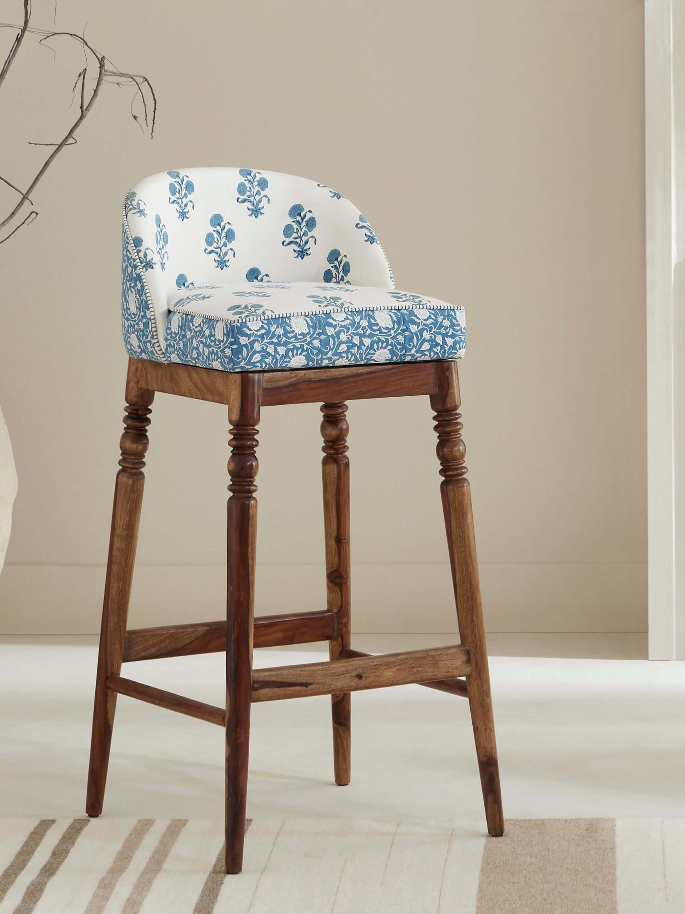 Side view of Upholstered Sheesham Wood Sanganeri Block Print Bar Chair highlighting artistic print and comfortable upholstery.