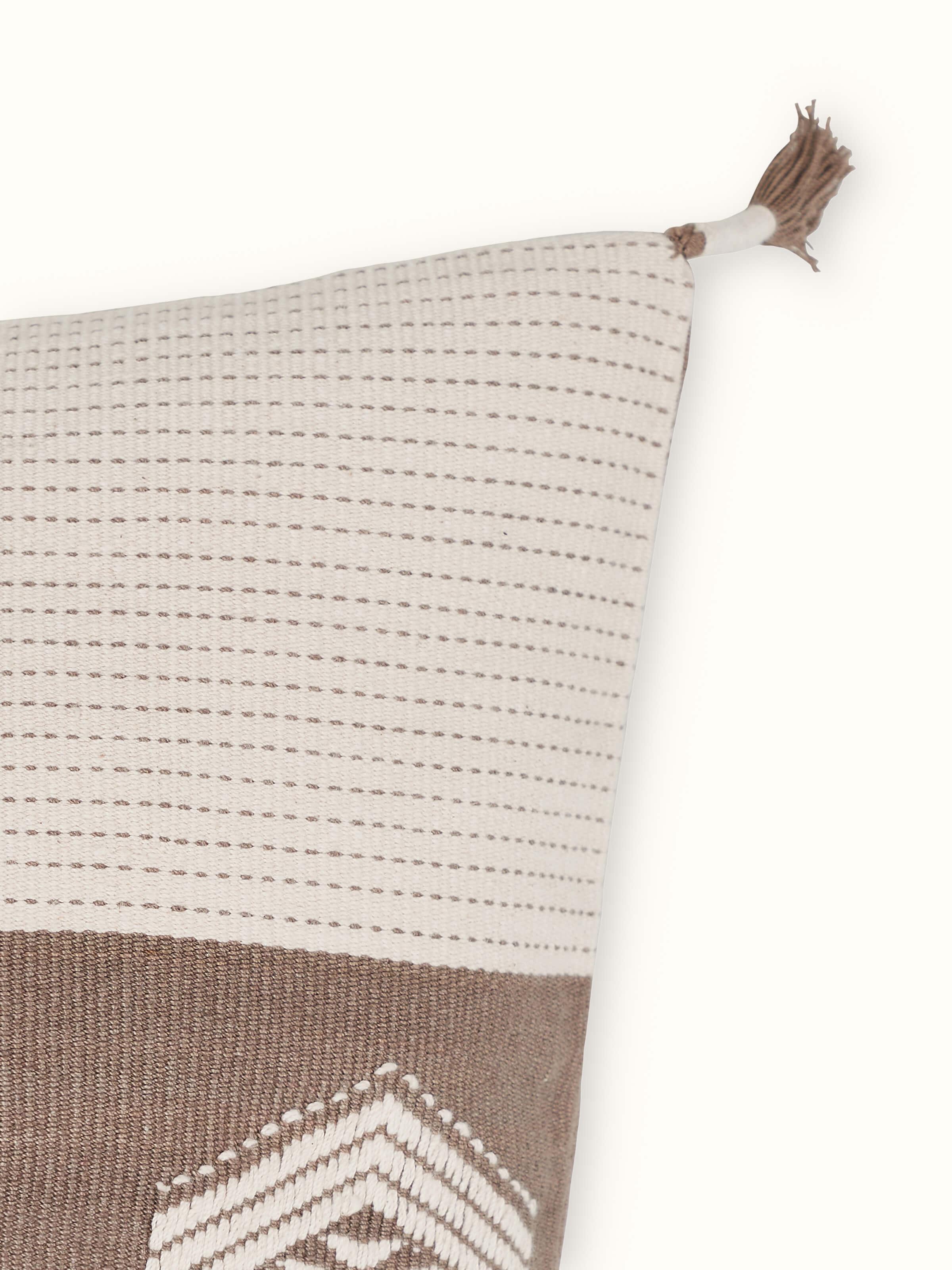Product image of Ridhima cushion cover featuring khaki base with buta motifs in traditional Naga handloom weave