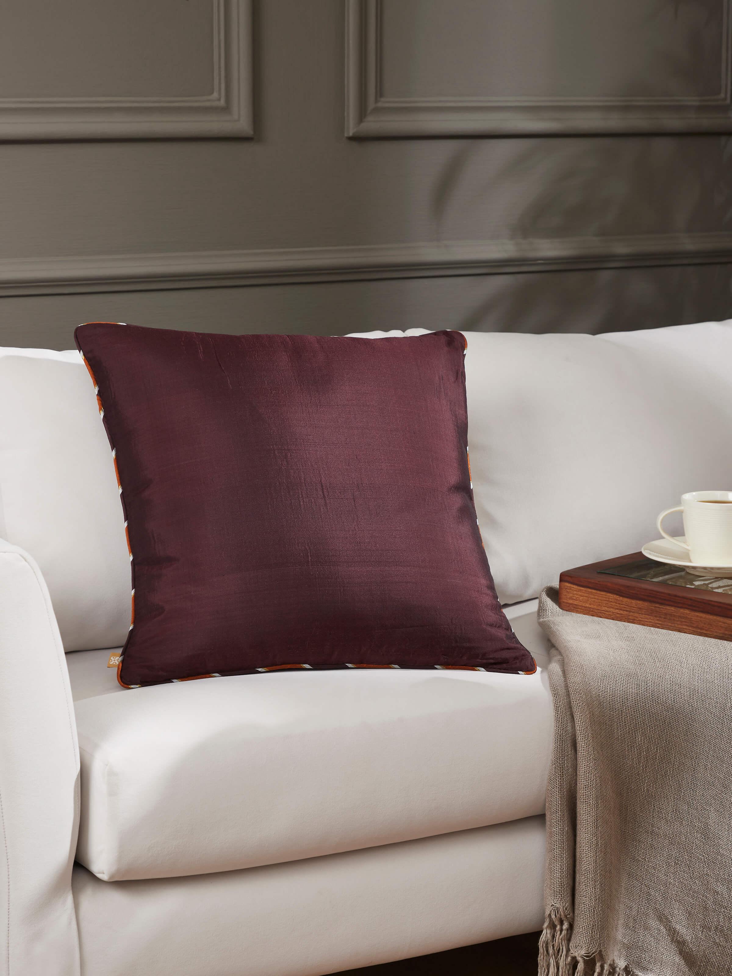 Lifestyle setting featuring handloom Ikat cushion in a cozy room arrangement.