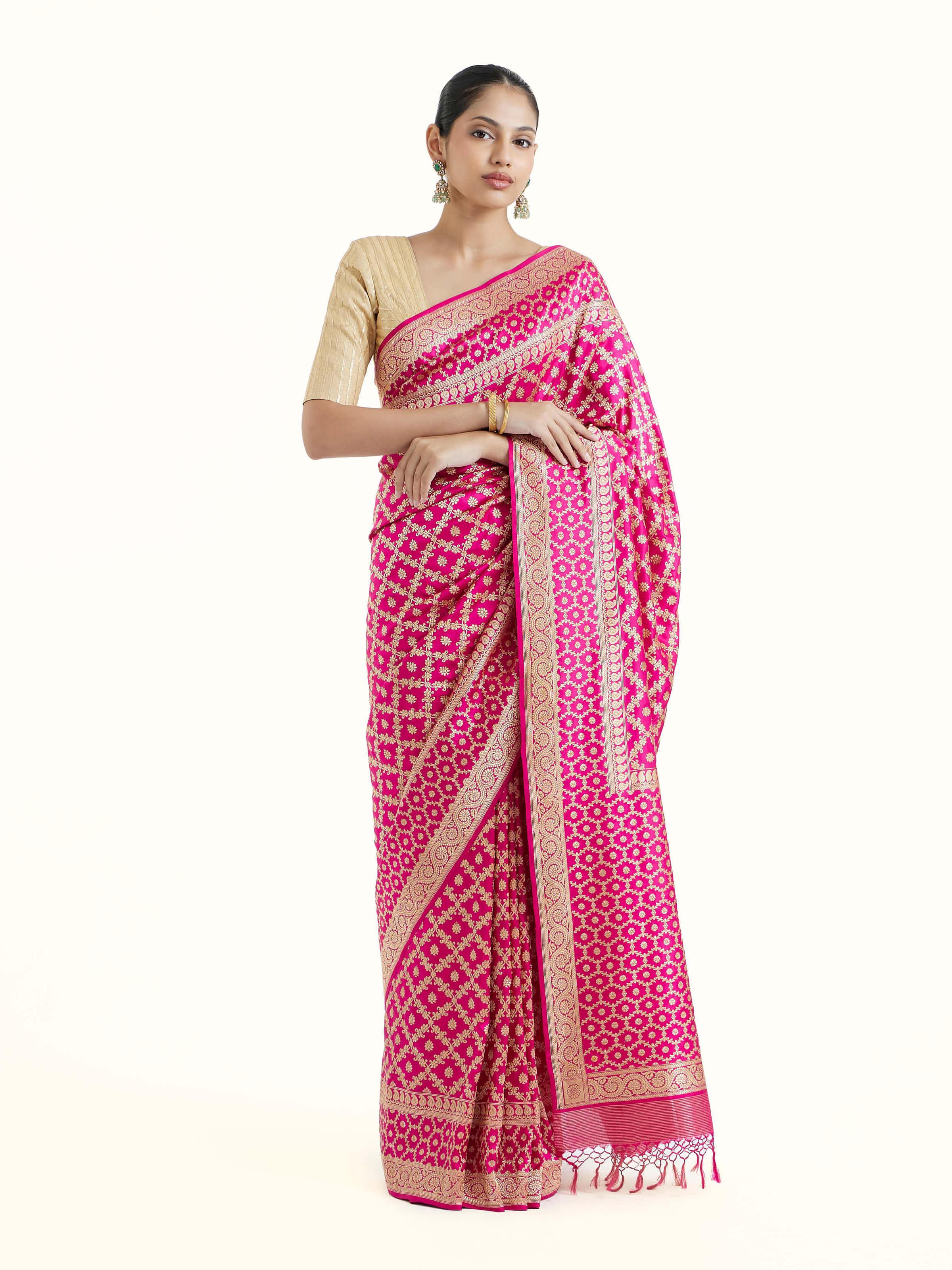 Front view of fuschia katan silk Banarasi saree with rich brocade motifs