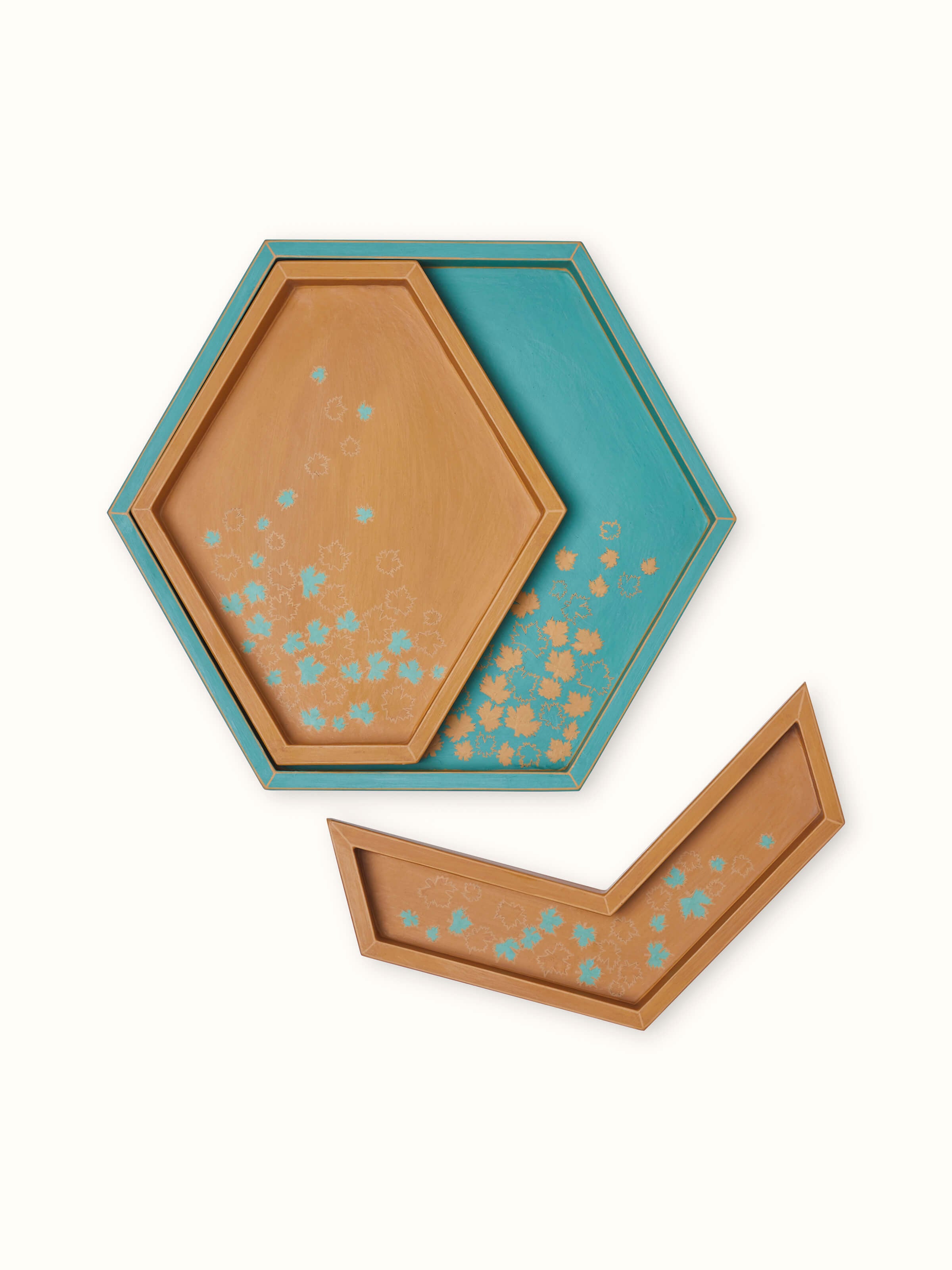 Angled view of papier-mâché decorative tray, showing its decorative elements and colorful design.