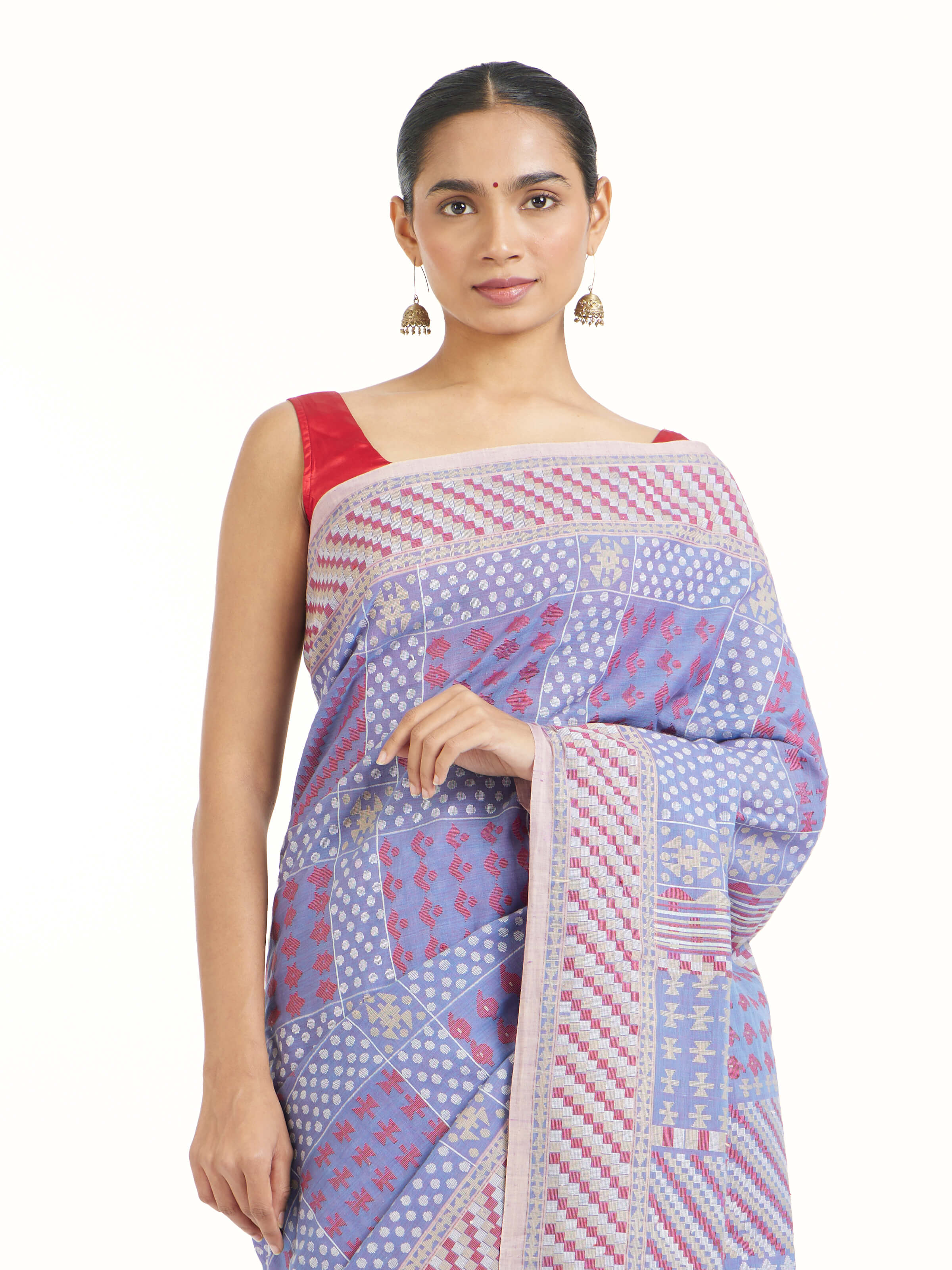 Angled view of beige cotton Bengal Jamdani saree highlighting jamdani weaving patterns