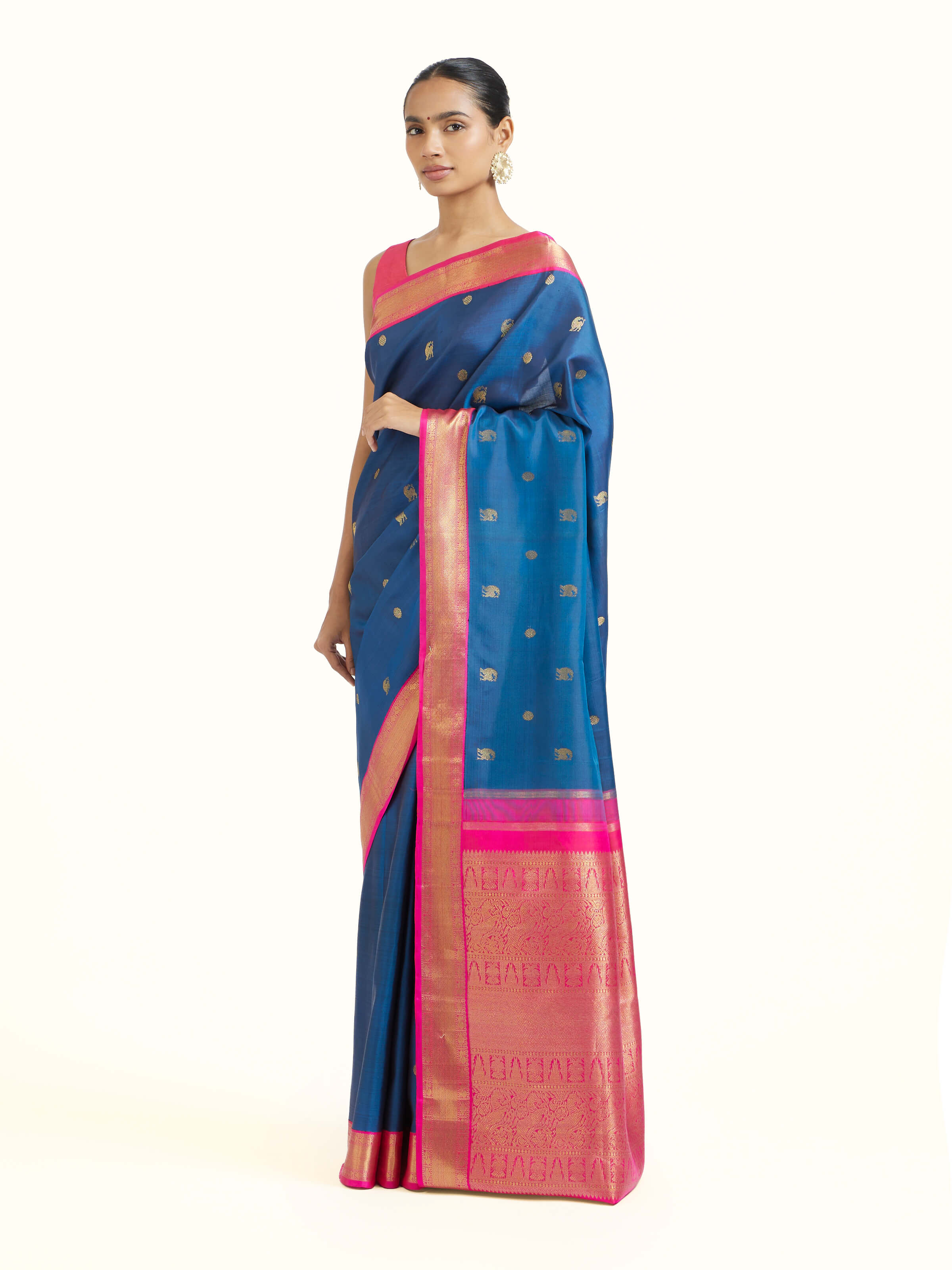 Side view of dark blue silk Kancheepuram saree with graceful drape and contrast border