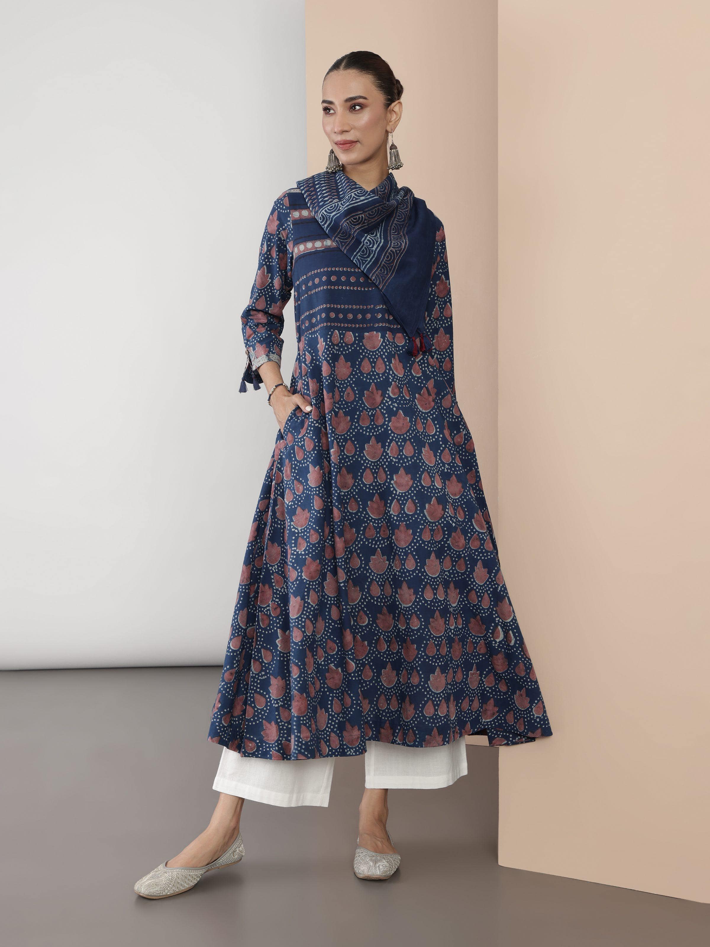Angled view of blue cotton Dabu block print A-line kurta showing print details and fabric fall.
