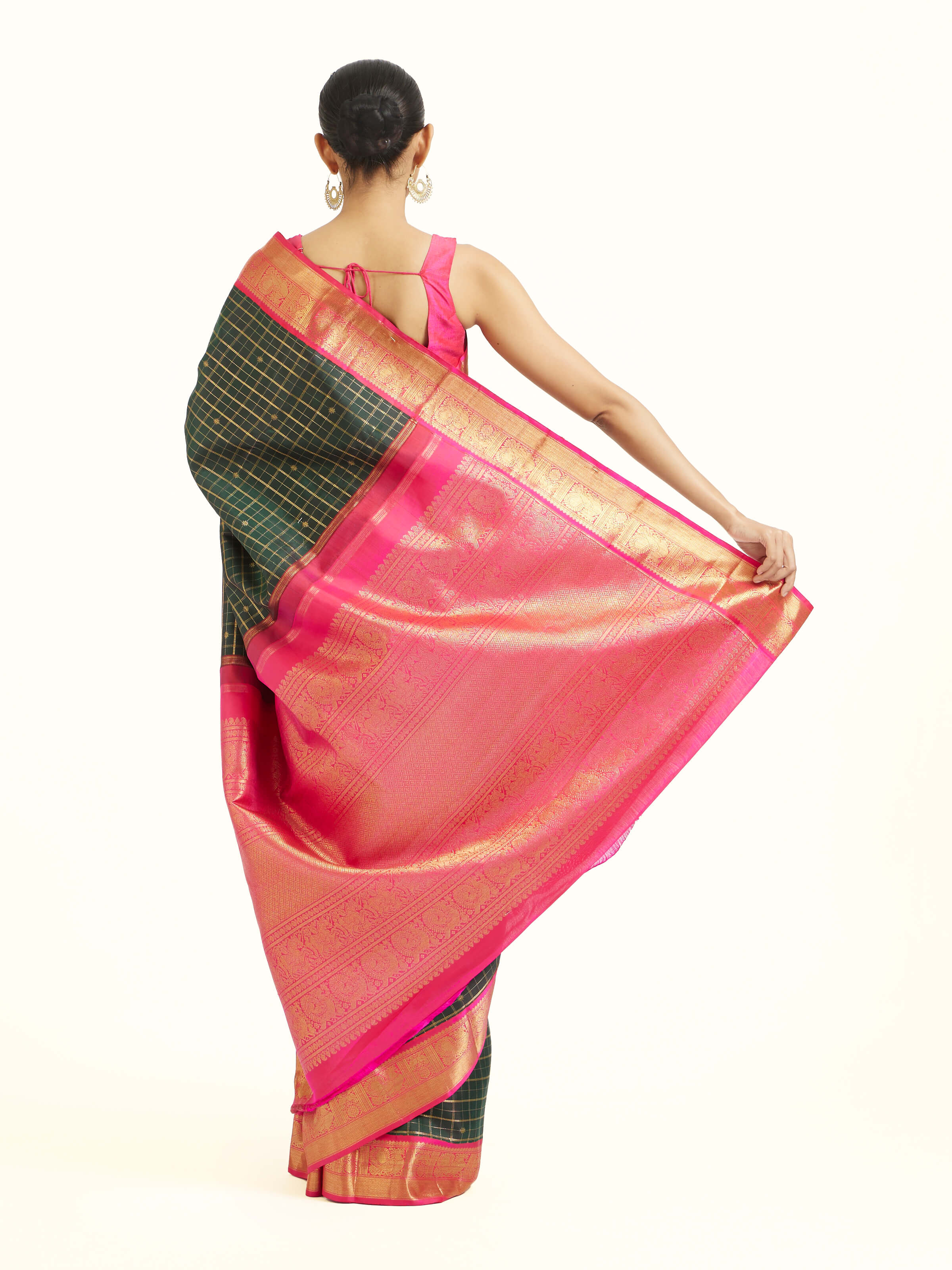 Back view of green silk Kancheepuram saree displaying ornate pallu design