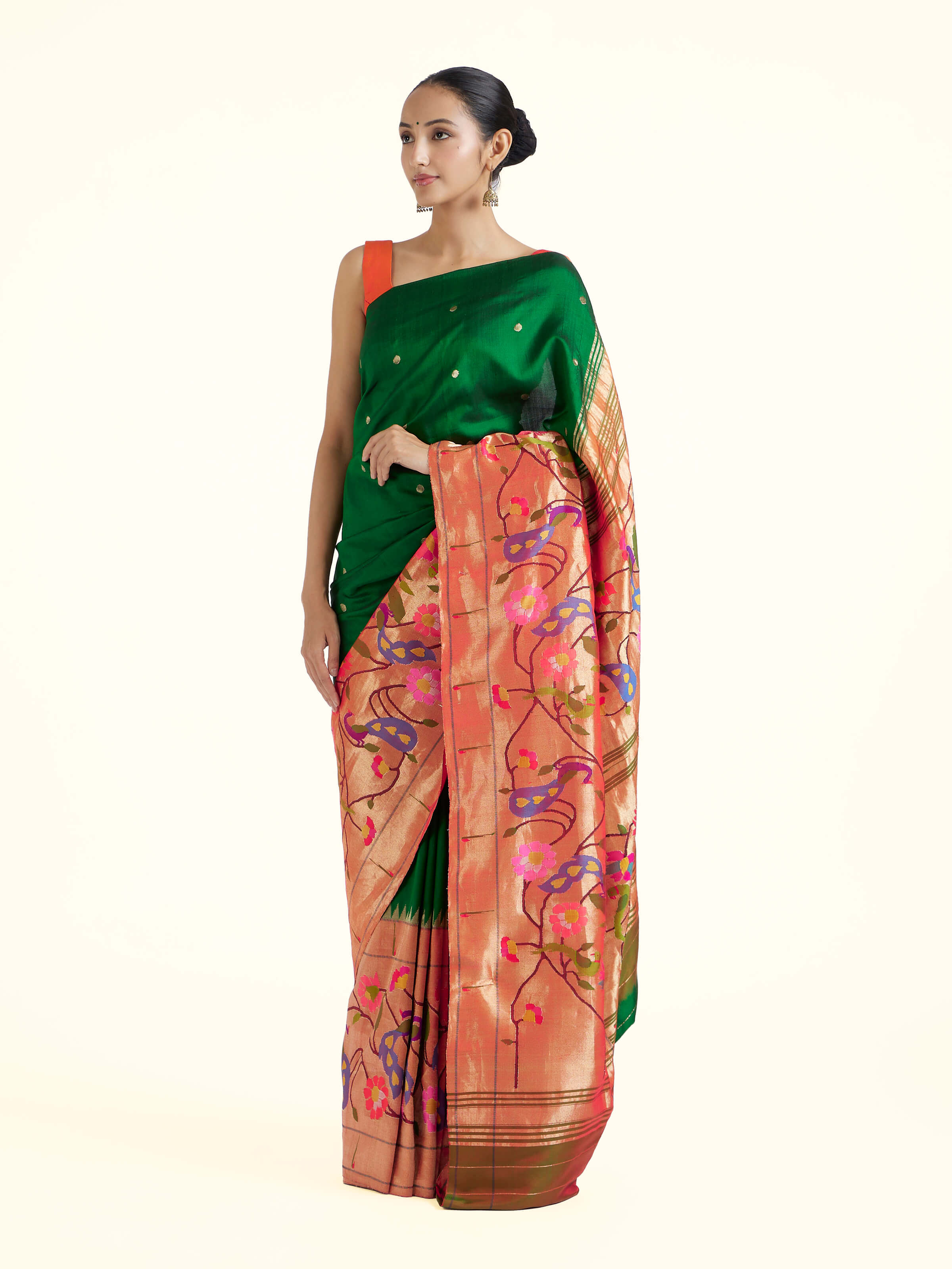 Side view of green silk Paithani saree highlighting graceful fall and rich border