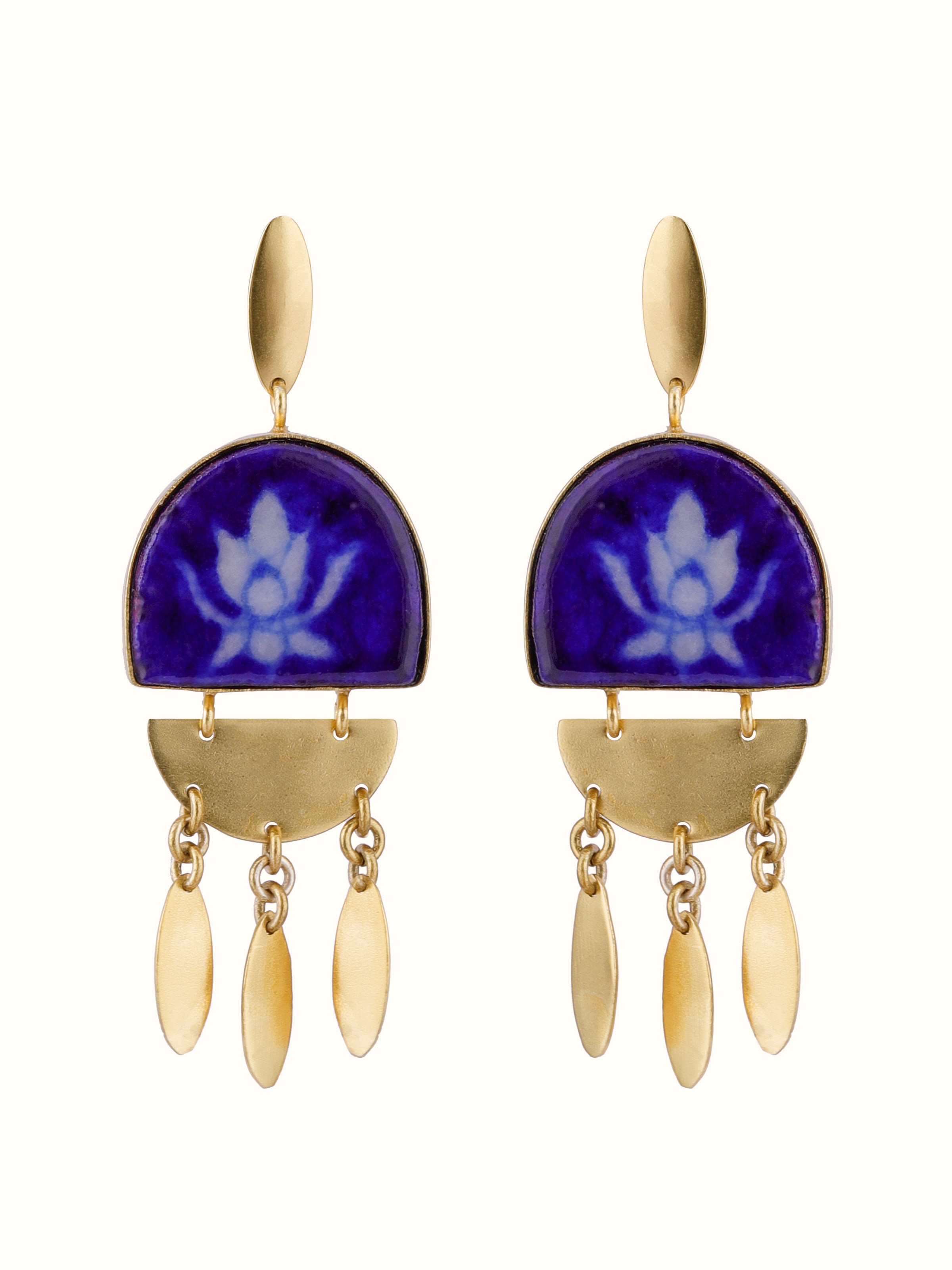 Front view of blue pottery drop earrings featuring traditional blue and white patterns