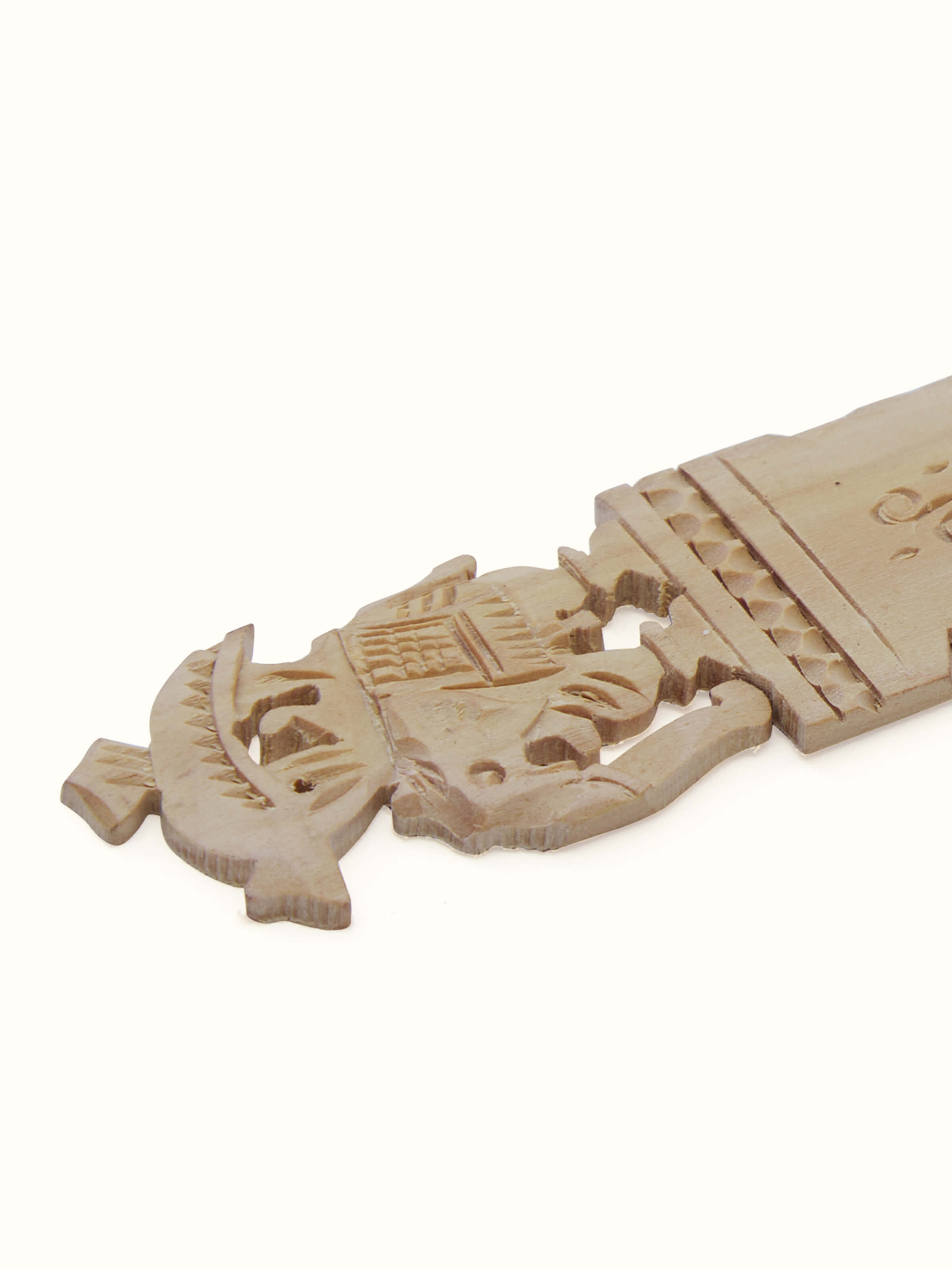 Detailed side view of Carved Sandalwood Elephant Bookmark by Swadesh emphasizing the smooth finish and intricate craftsmanship.