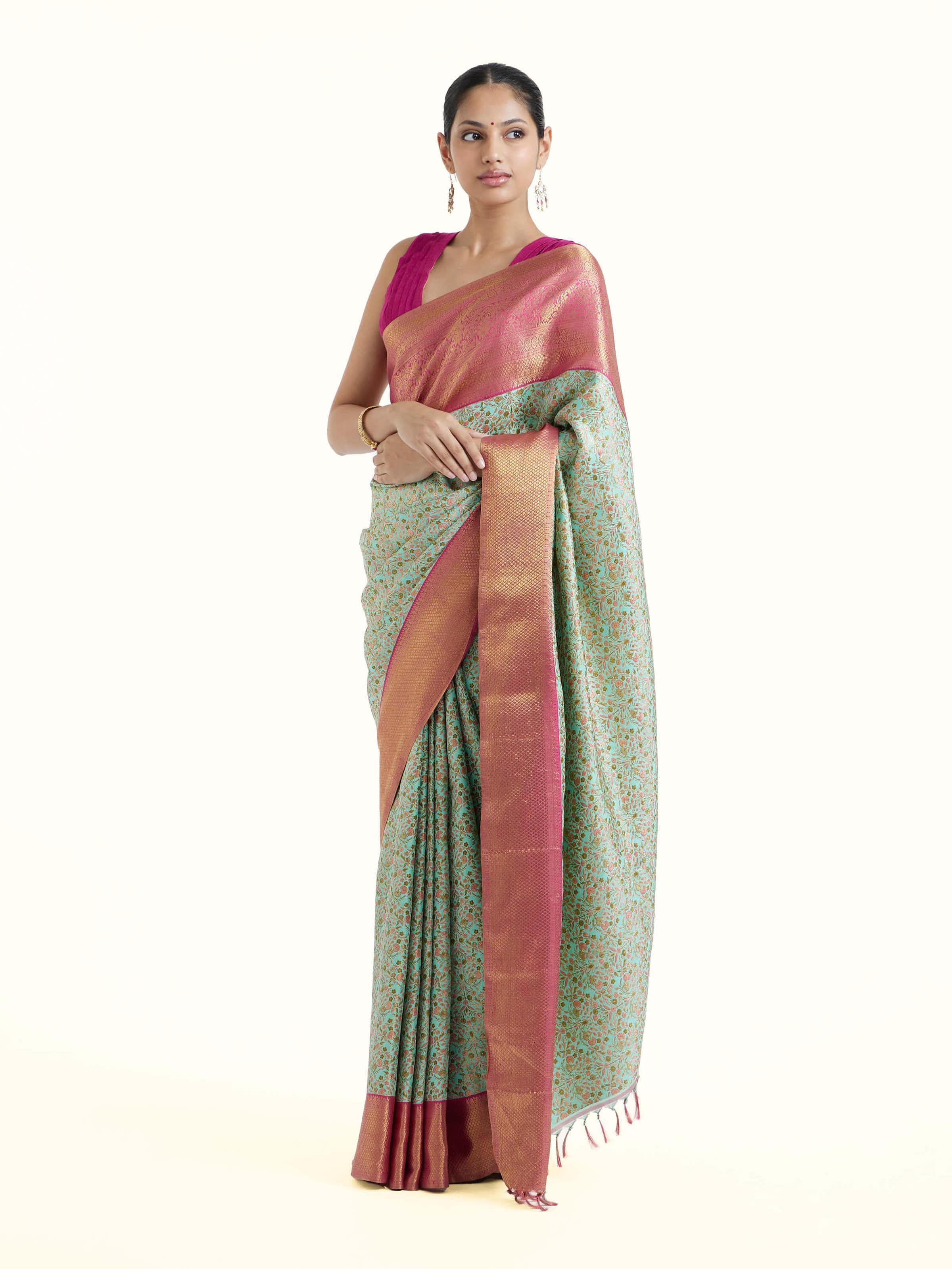 Side view of sea green silk Kancheepuram saree with graceful drape and broad border