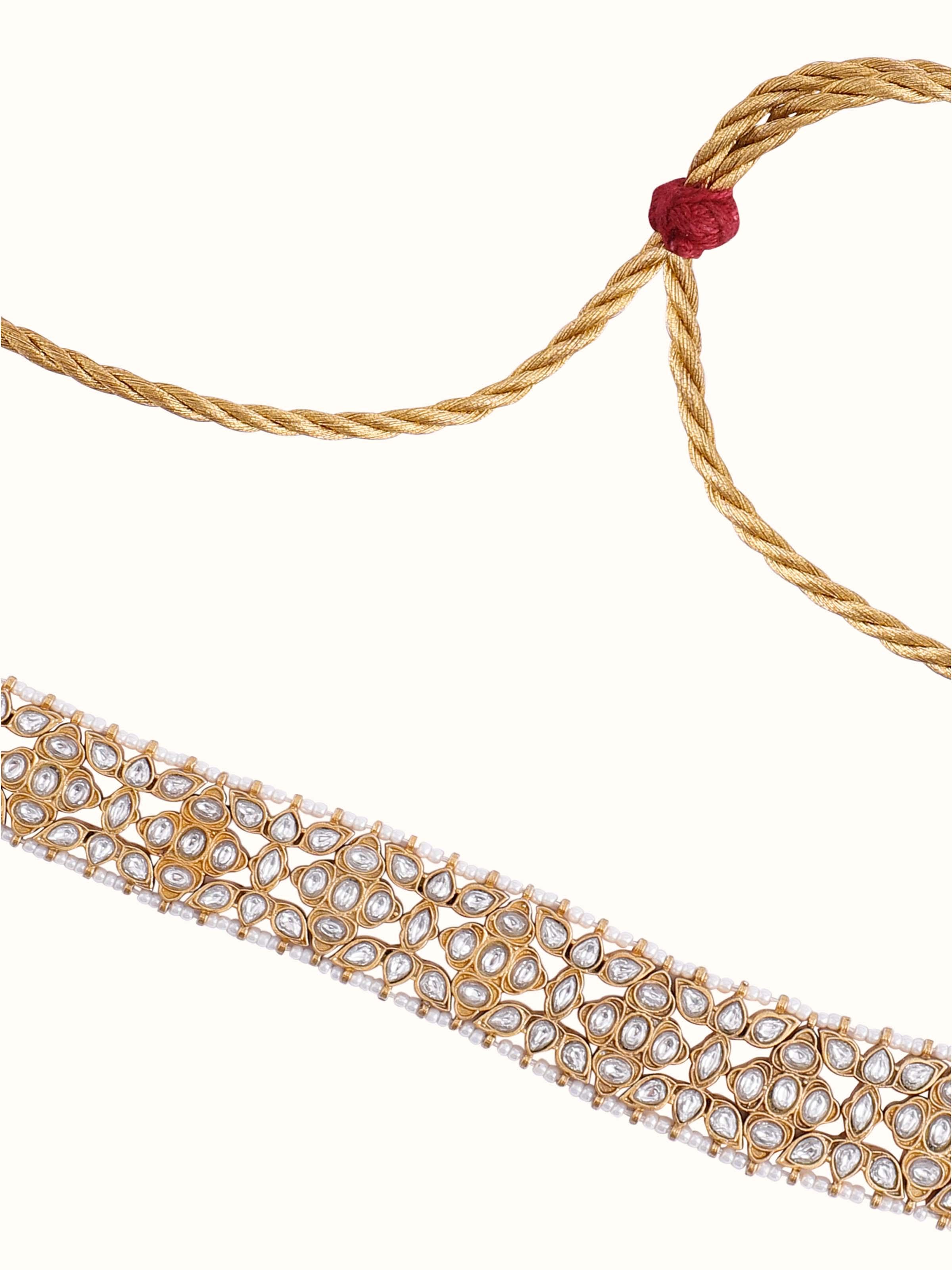 Overhead view of silver choker arranged flat to highlight arc and texture