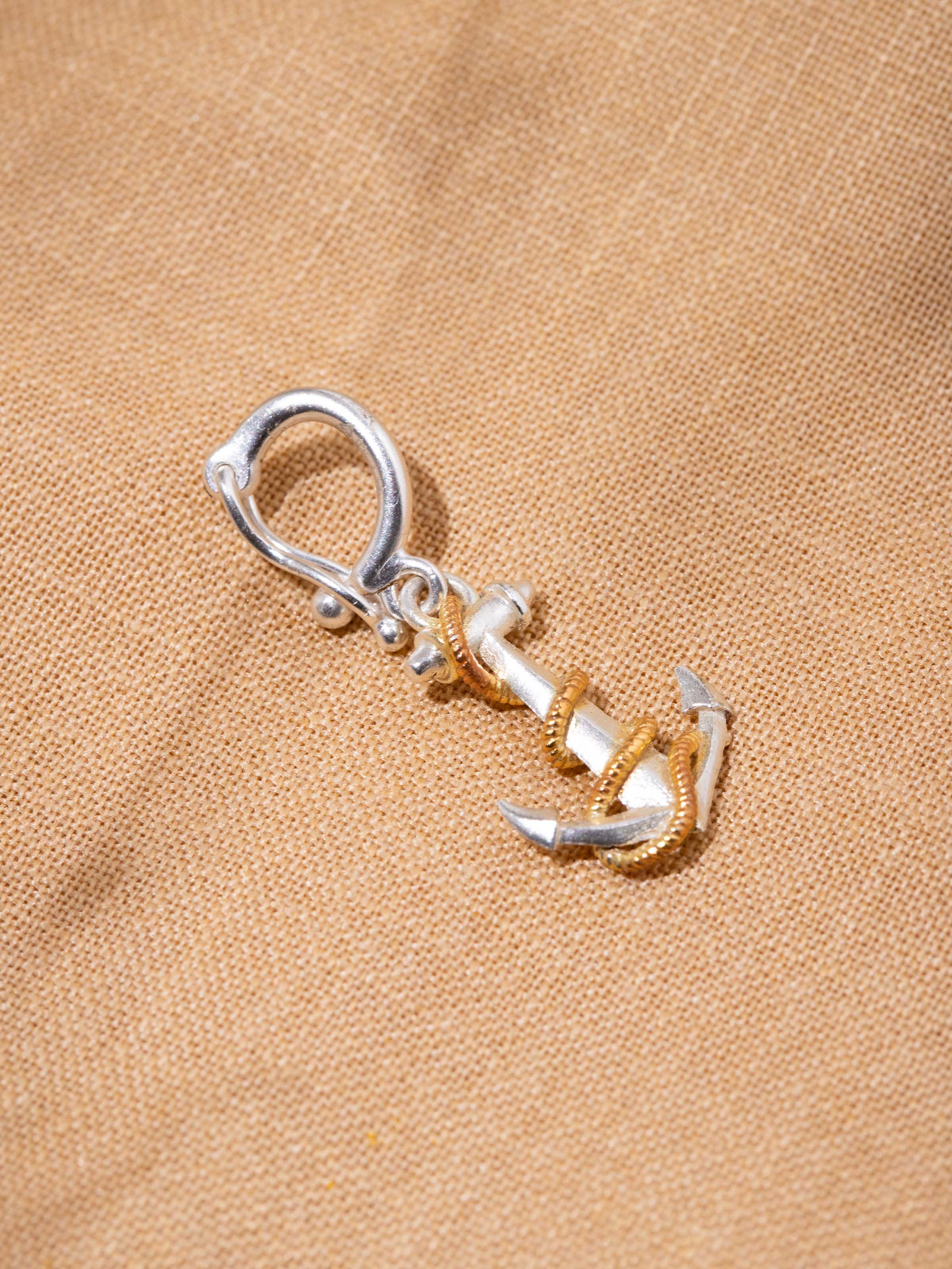 Close-up of handcrafted silver smithing detail on pendant