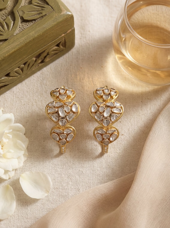 Lifestyle view of dank polki 14 karat gold hoop earrings