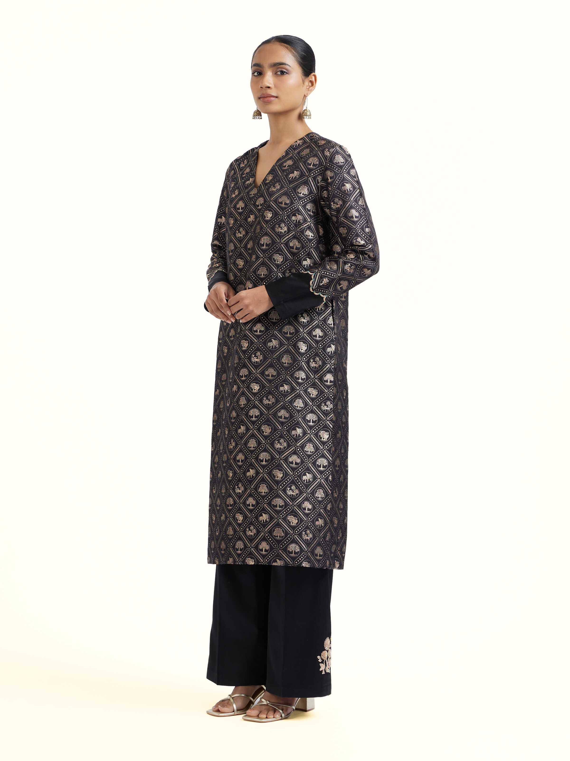 Side view of black silk Banarasi kurta set highlighting classic silhouette
