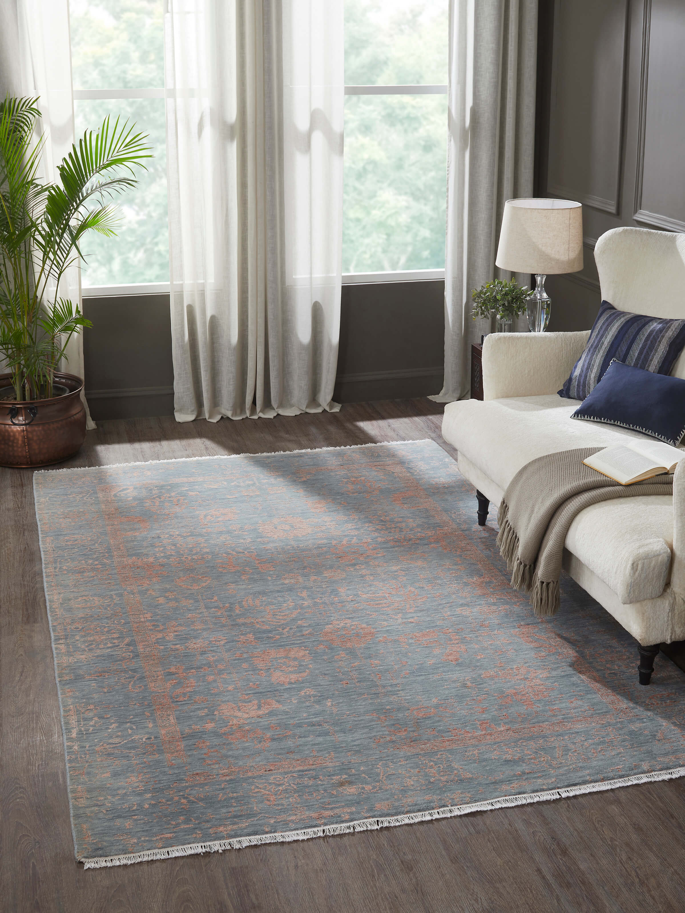 Distressed transitional Agra carpet placed in a modern living room – lifestyle shot