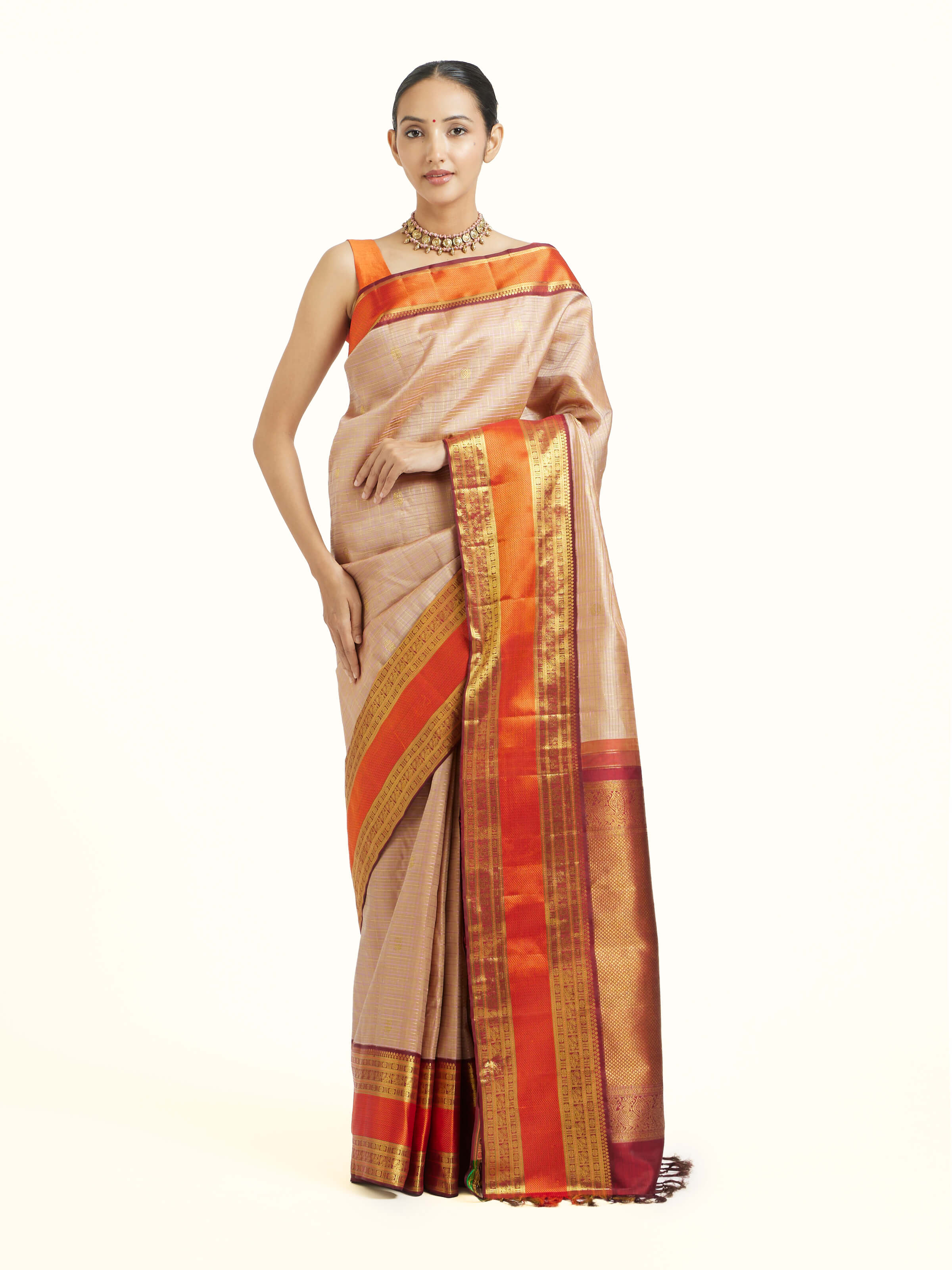 Front view of biscuit silk Kancheepuram saree with rich zari border