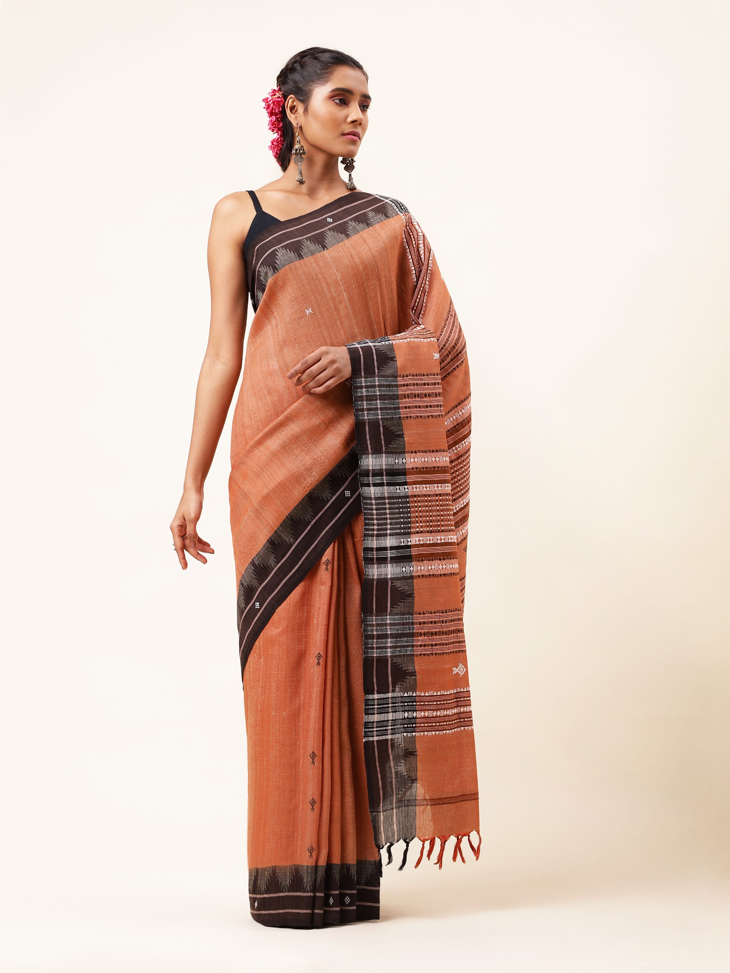 Front view of the brown cotton tussar silk Kotpad saree, featuring tribal-inspired weaves and earthy tones.