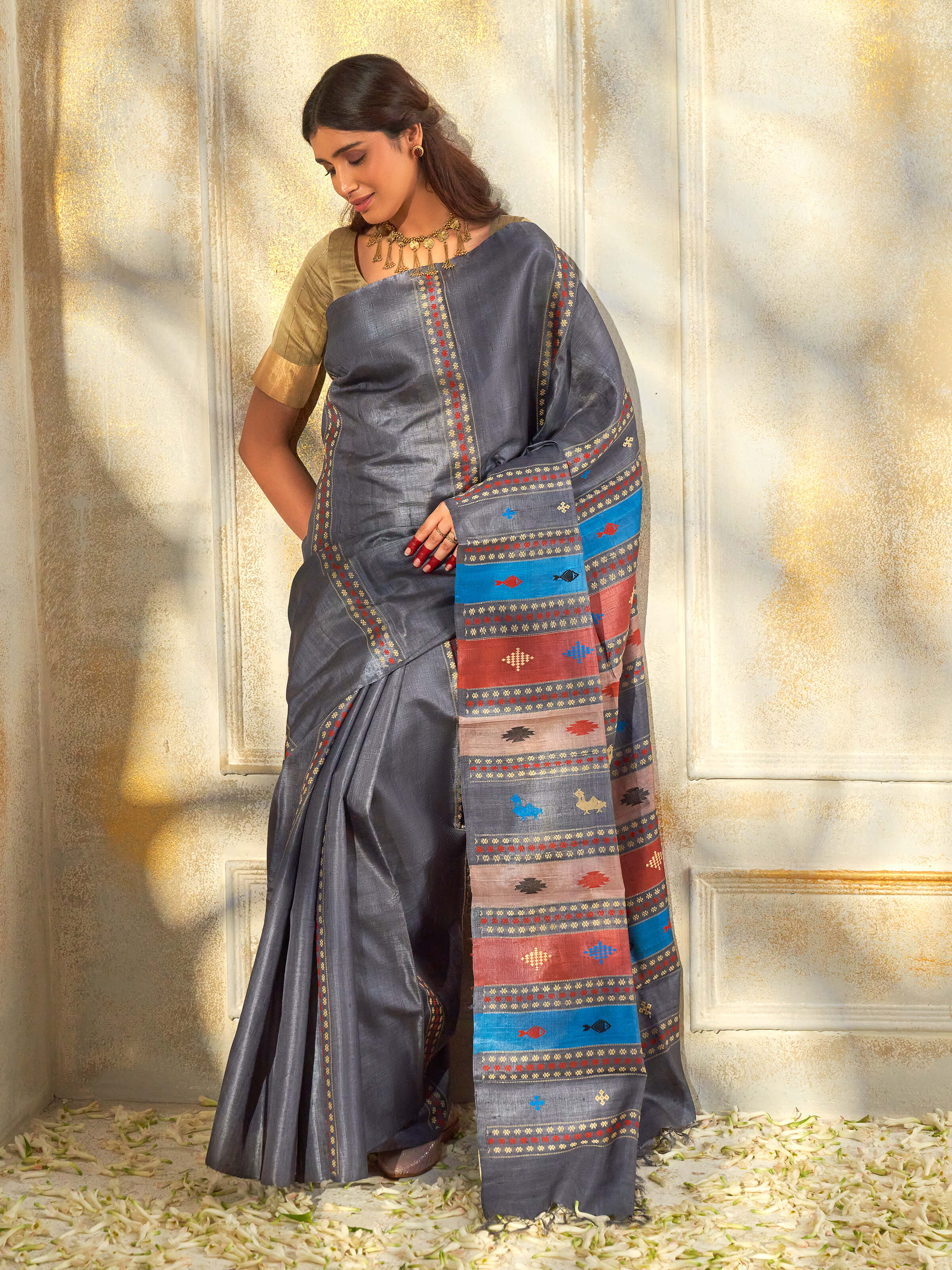 Side view of black tussar silk extra-weft saree with graceful drape and textured finish