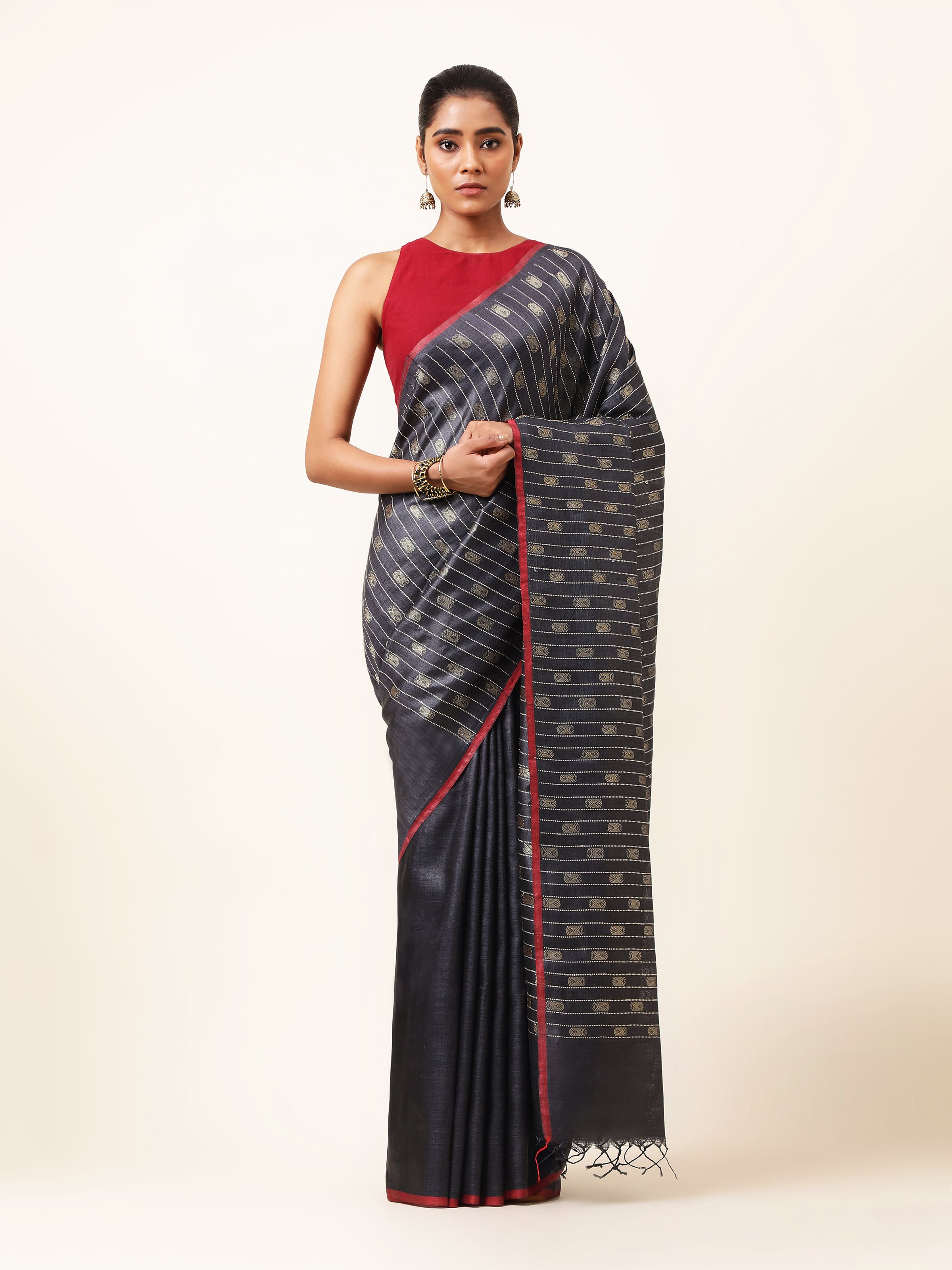 Front view of blue Tussar silk Odisha Ikat saree with bold traditional motifs.