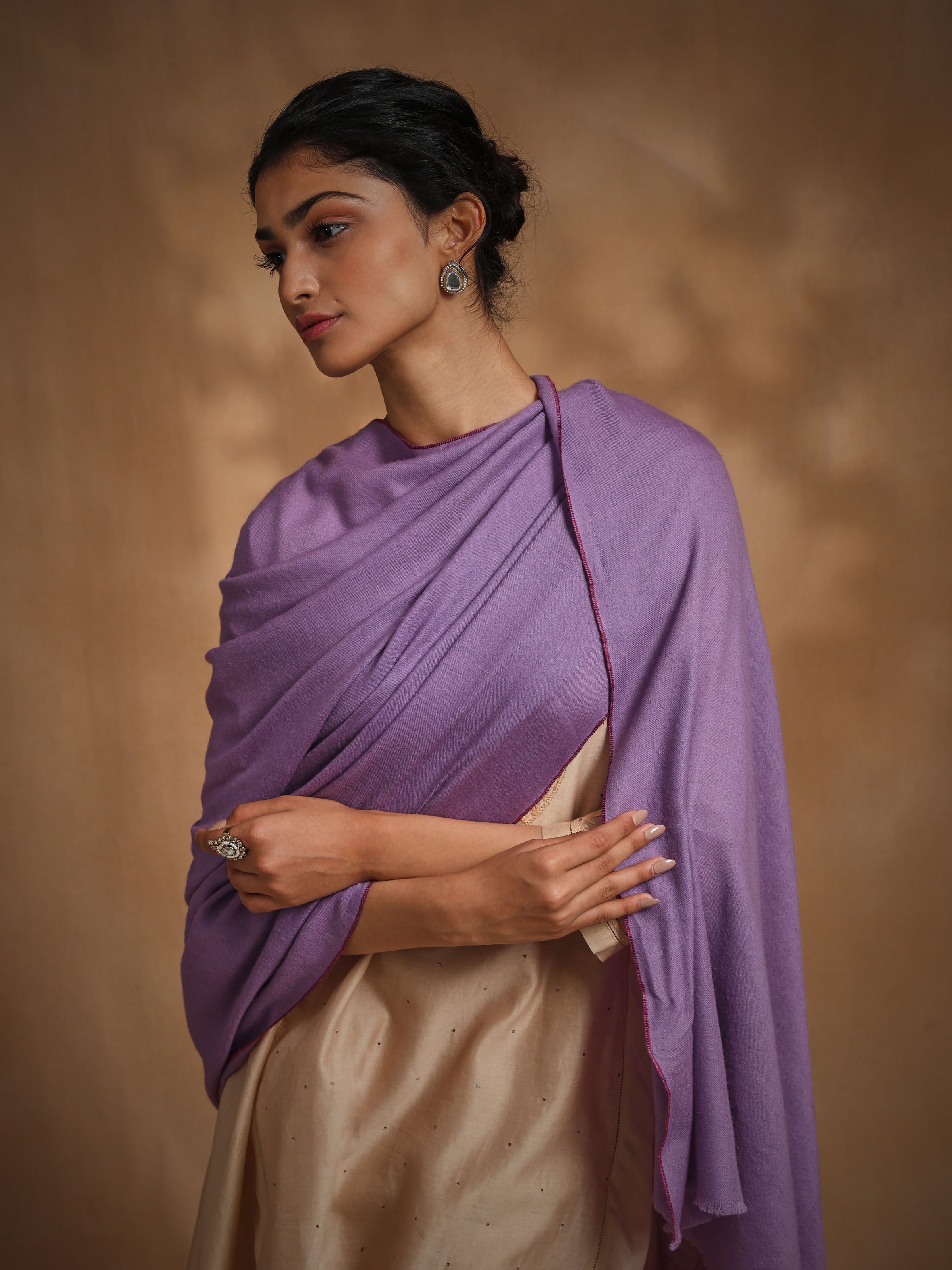 Angled view of purple cashmere kaaj embroidered handwoven stole emphasizing intricate kaaj work