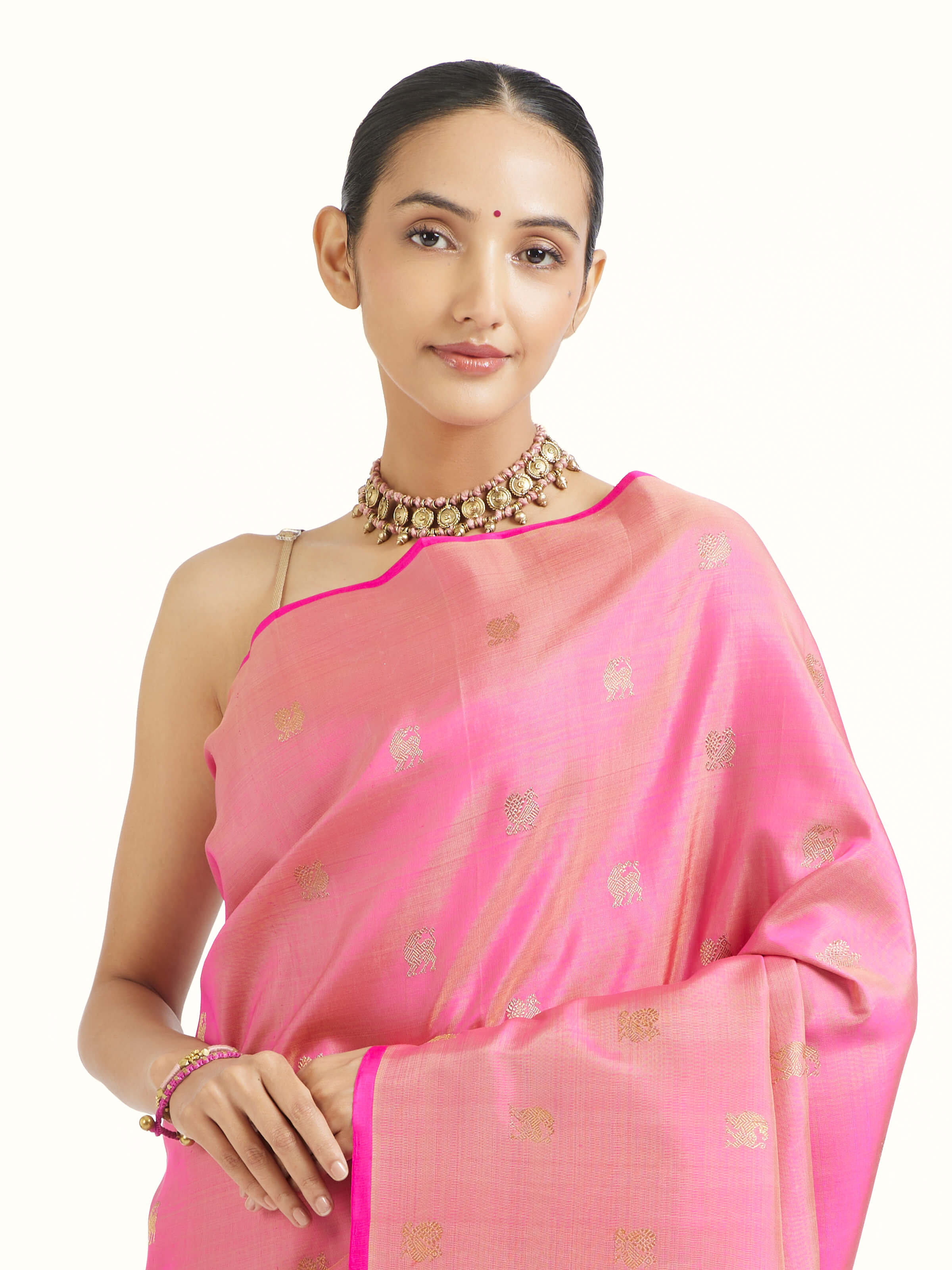 Angled view of pink silk Kancheepuram saree emphasizing traditional weave