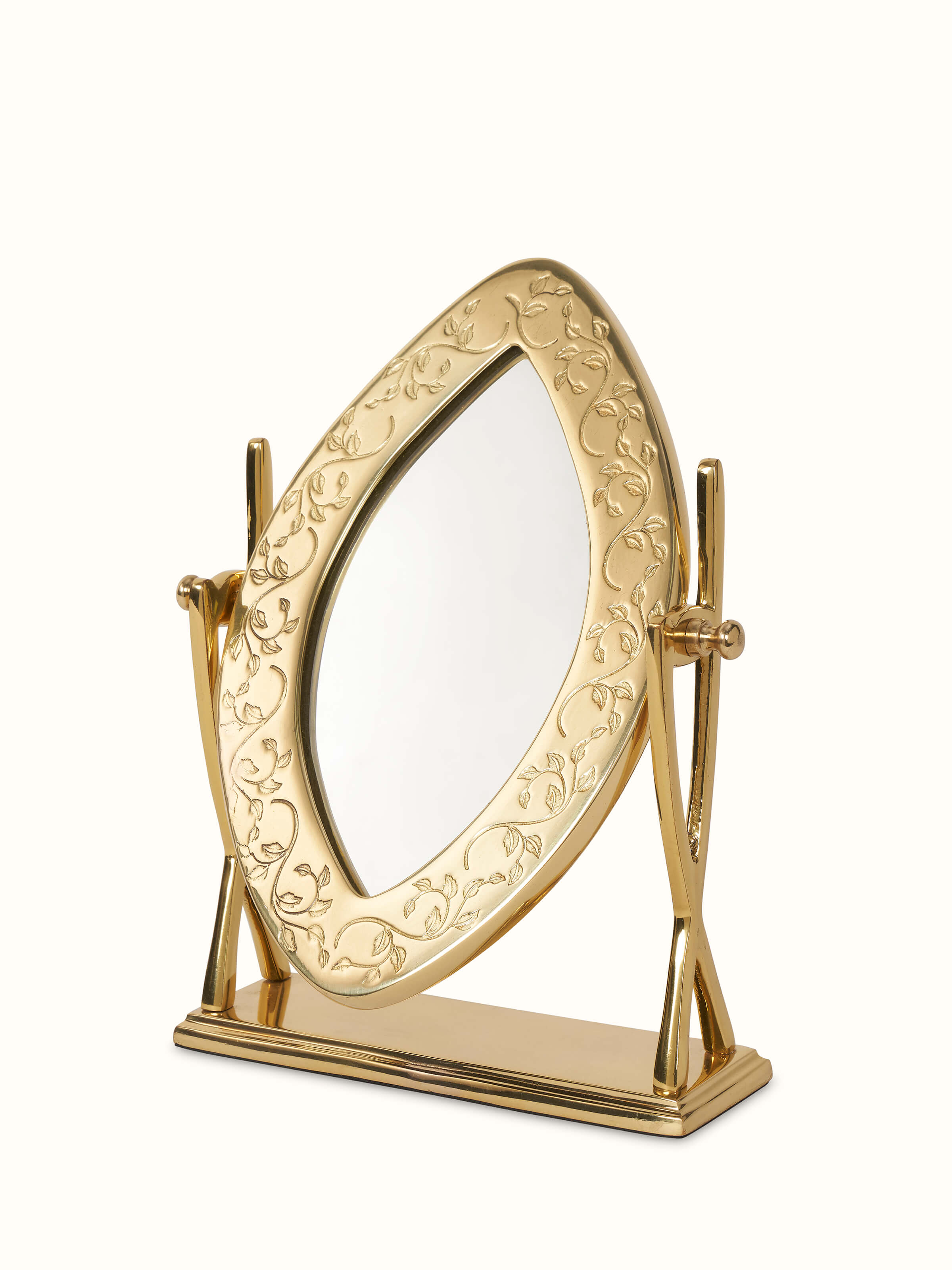 Side view of brass-plated table mirror showcasing its detailed design