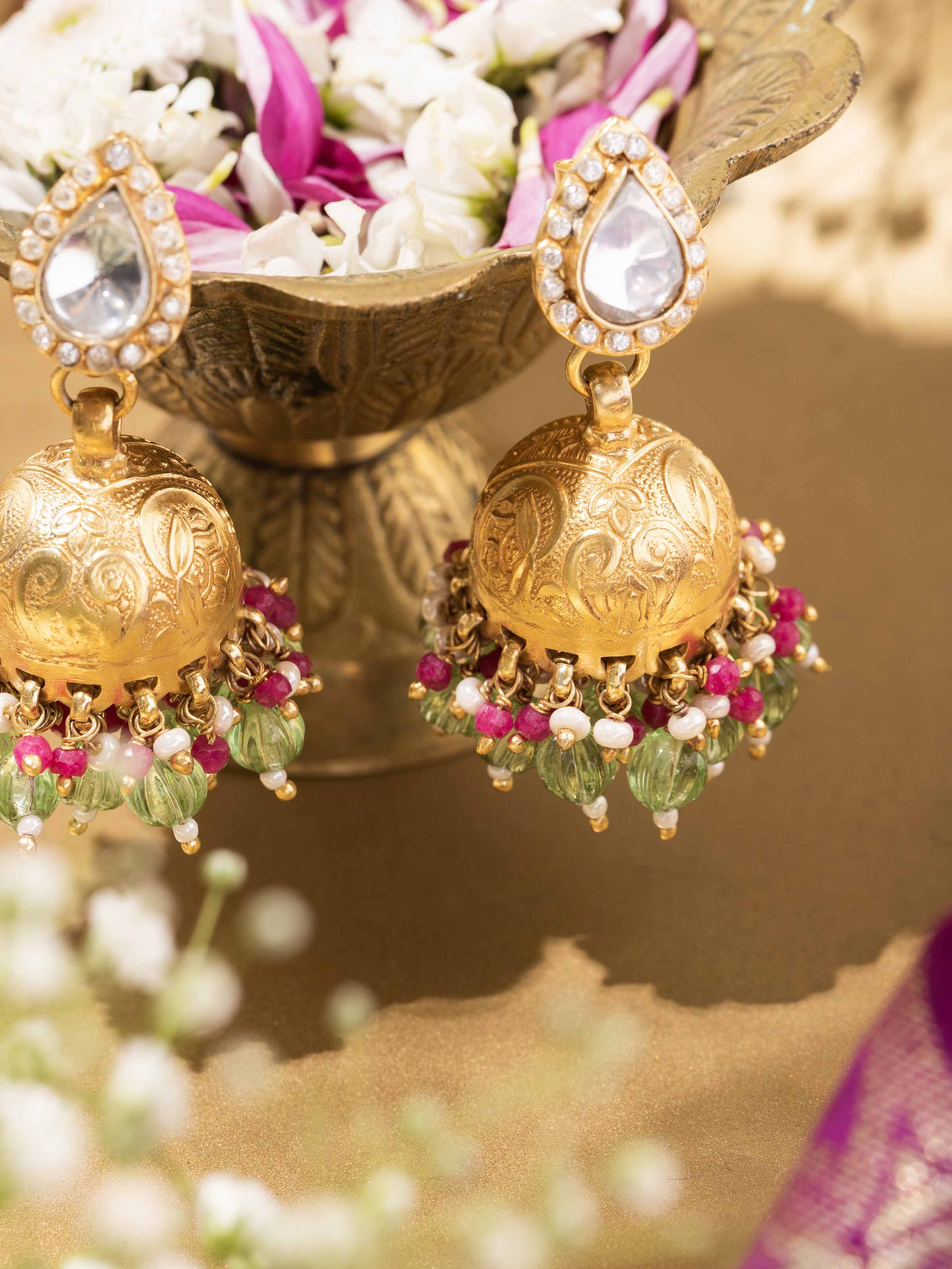 Profile shot showcasing jhumka earrings from an angle displaying depth and form