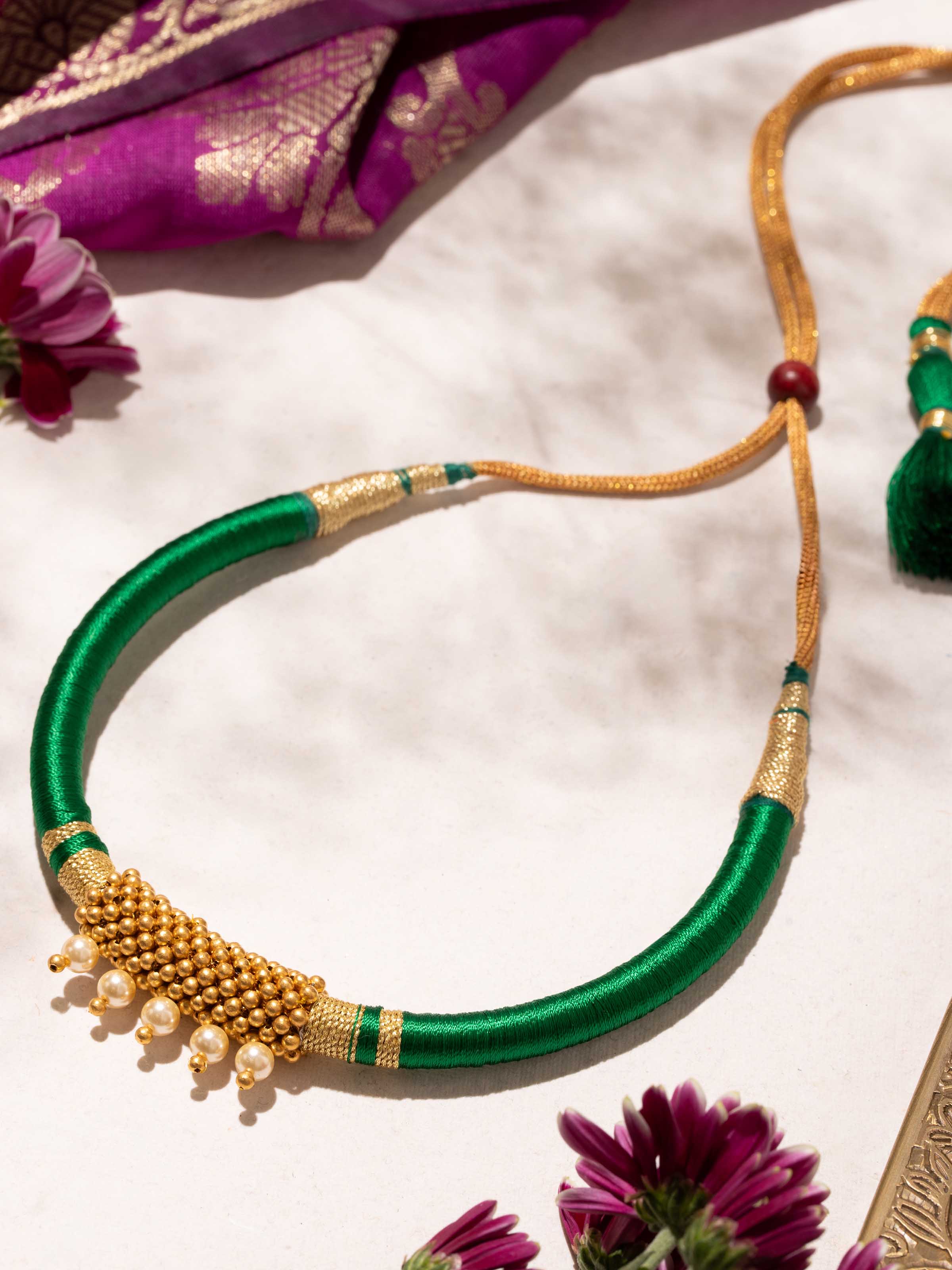 Thushi gold collar necklace close-up on display – Swadesh