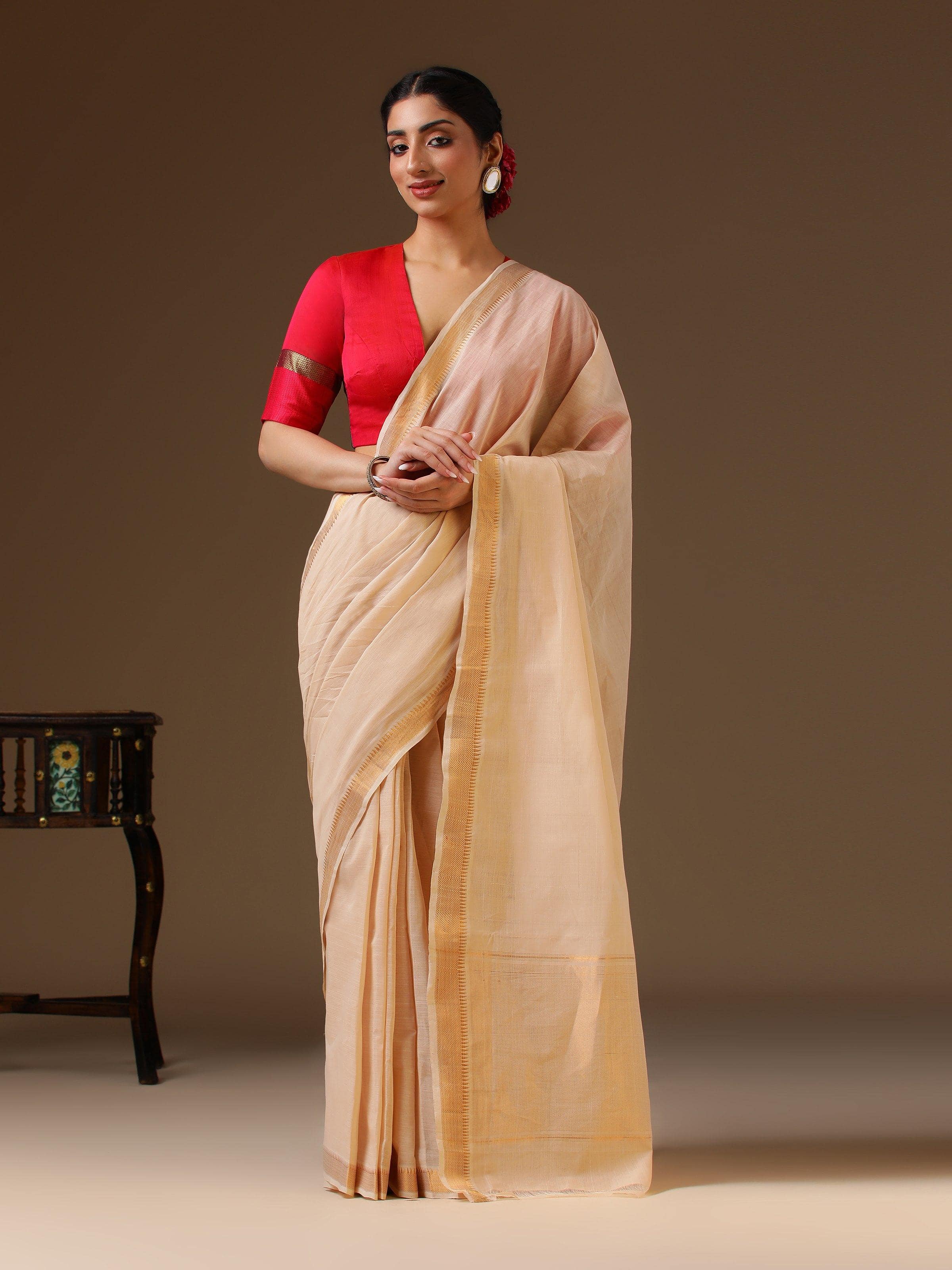 Lifestyle view of off-white Mangalgiri saree styled traditionally on model