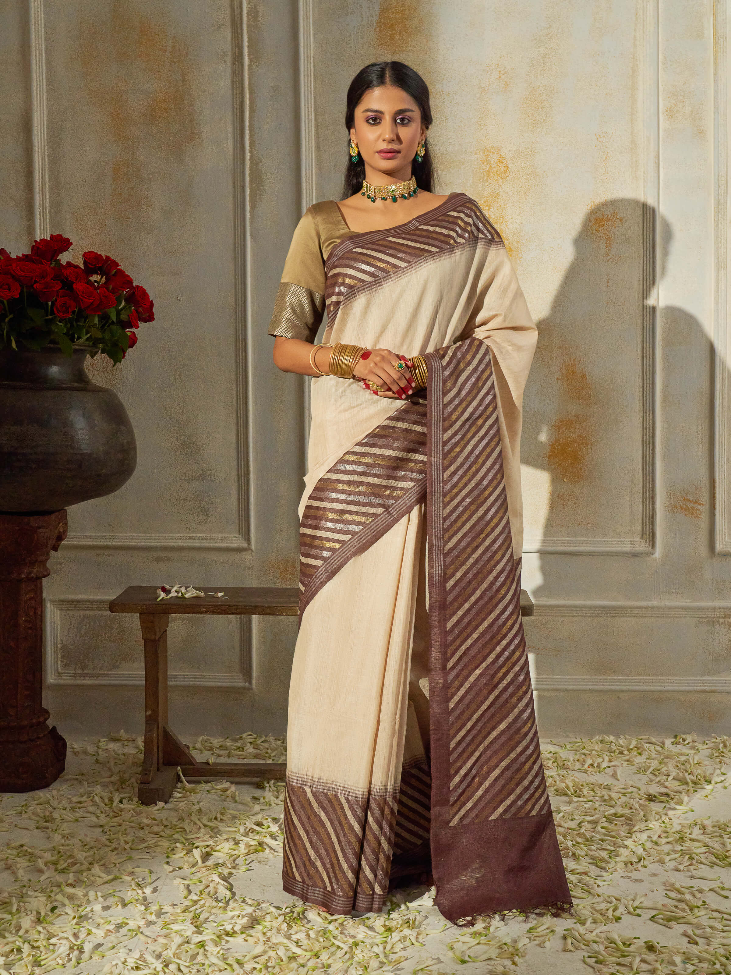 Side view of beige tussar muga silk saree showcasing earthy texture