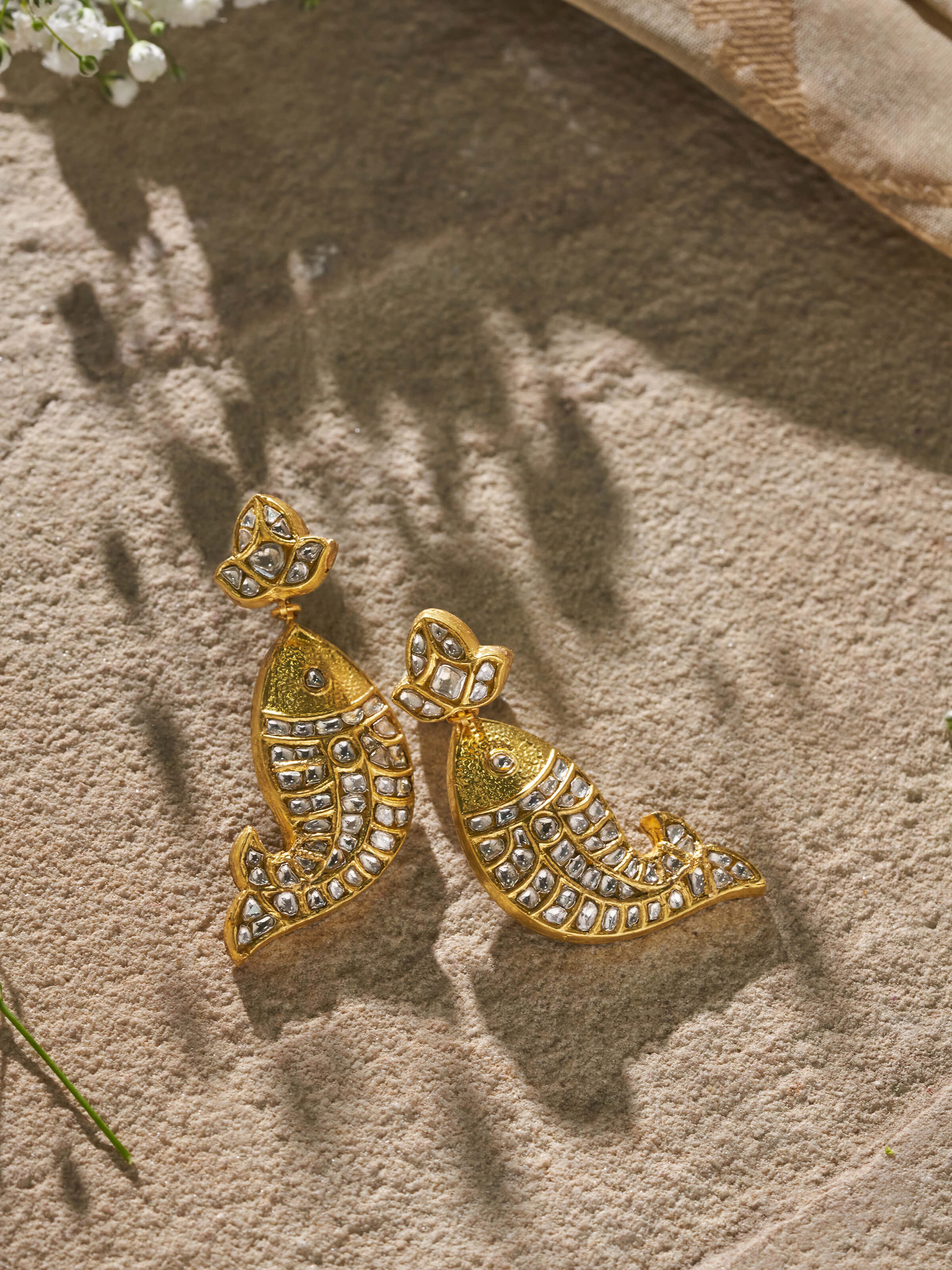 Side view of Thappa 22 Karat Gold Drop Earrings highlighting detailed gold work and delicate drop design.