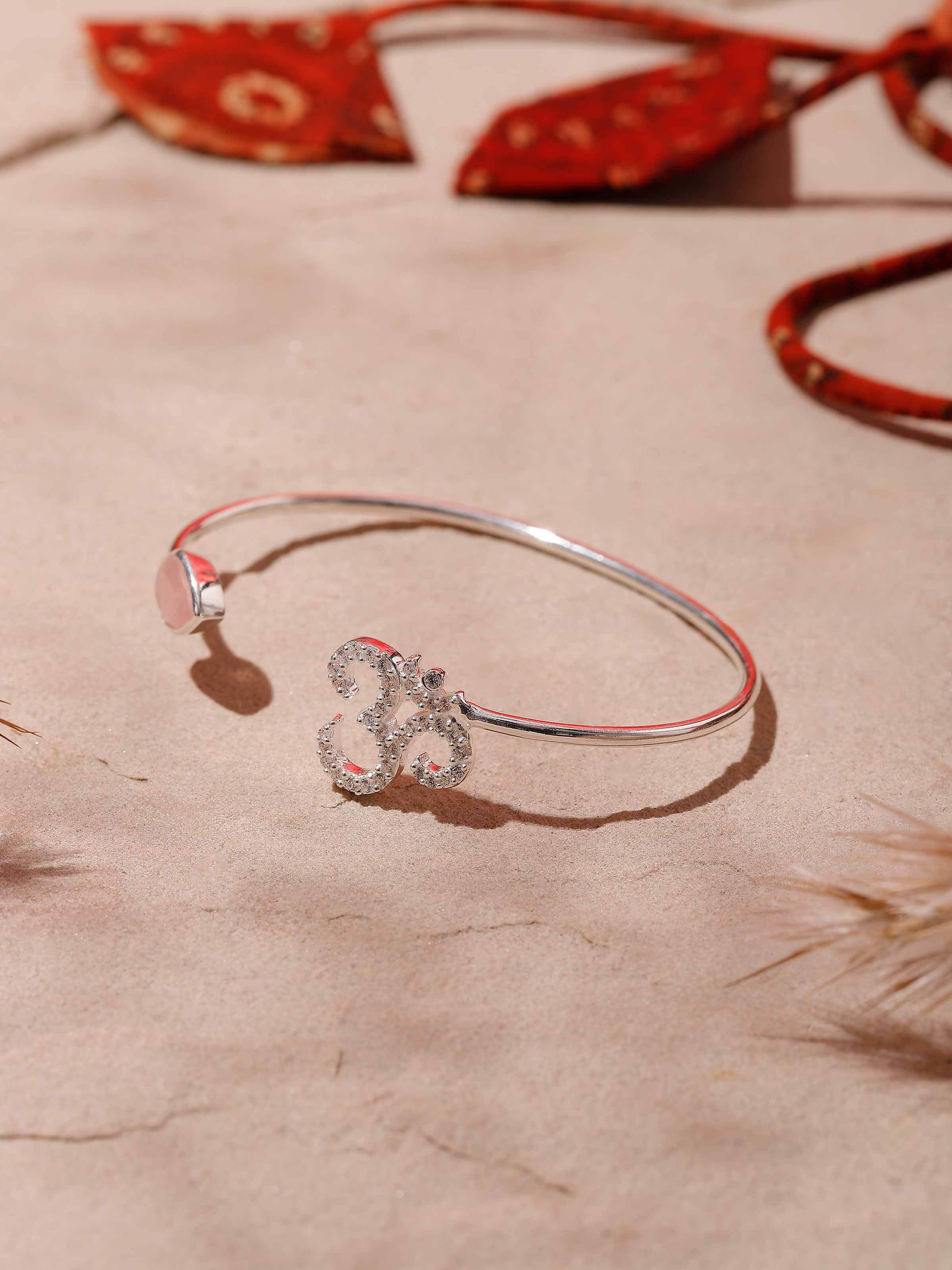 Side view of Rose Quartz & Om Bracelet, emphasizing the gentle rose quartz and sacred symbolism