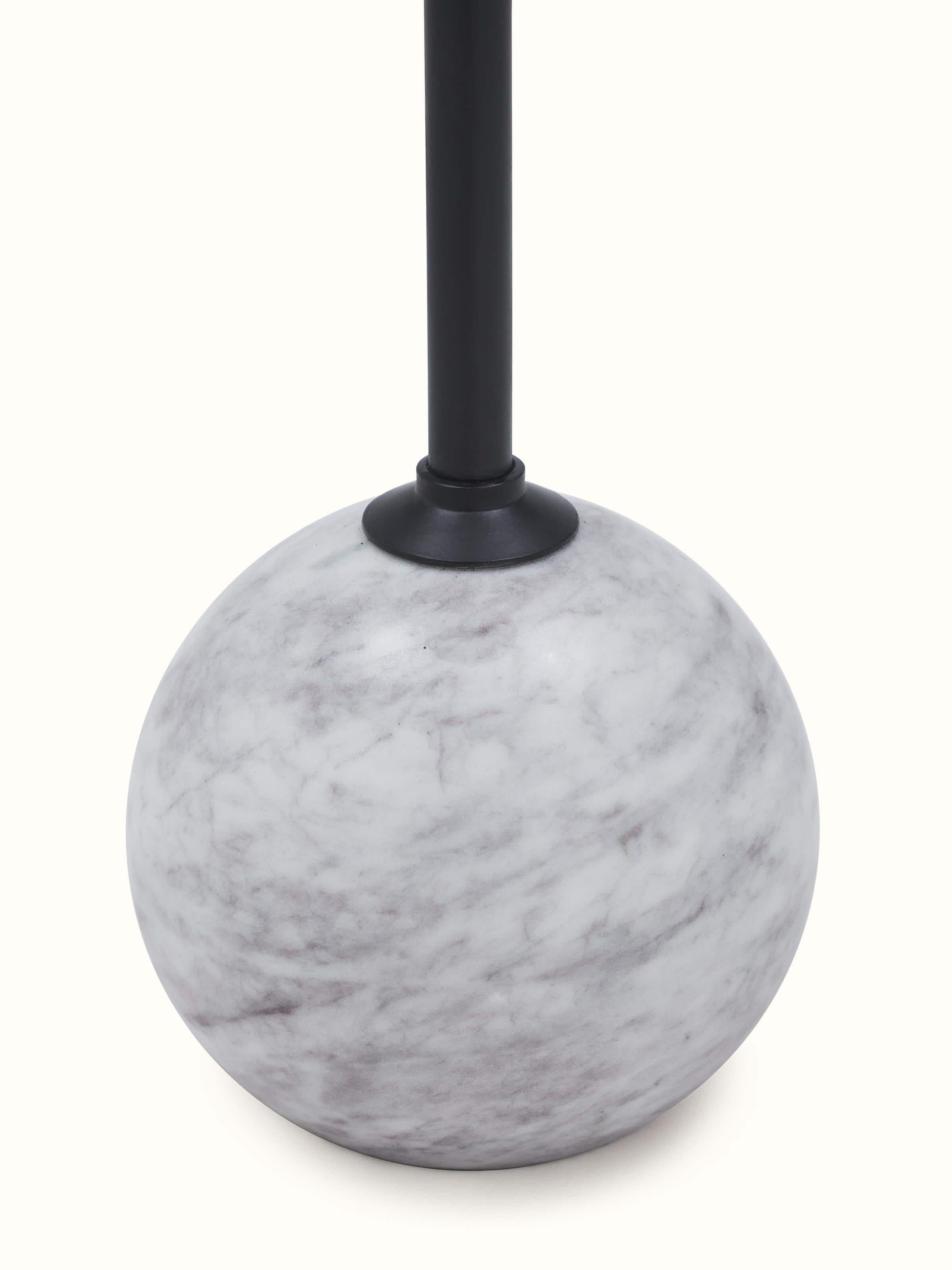 Close-up view of carved marble & metal end & side table highlighting intricate metalwork details